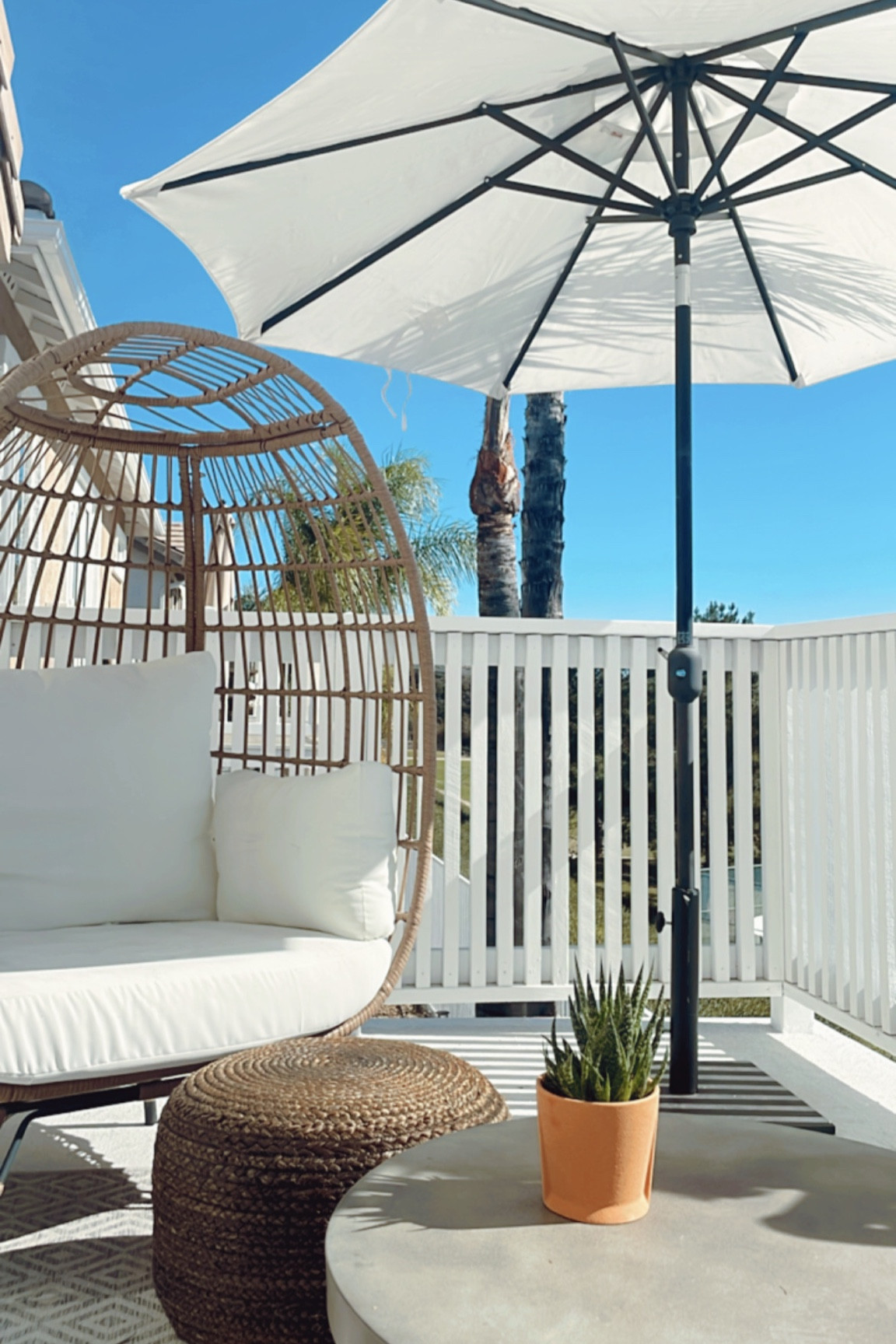 Balcony decor for year round outdoor living. I just wish you could see the view! 🙌🏻

This egg chair comes in multiple color options and I linked some similar outdoor concrete coffee tables. 

#balconyfurniture #patio #outdoorfurniture 

#LTKhome