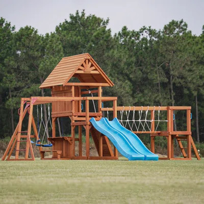 Dolphin Playground Luxury Cedar Playground Set: Double Wave Slide, 2-in-1 Table, Monkey Bars, Balance Beam, 3 Swings, Large Rock Wall, Wood Roof | Wayfair North America
