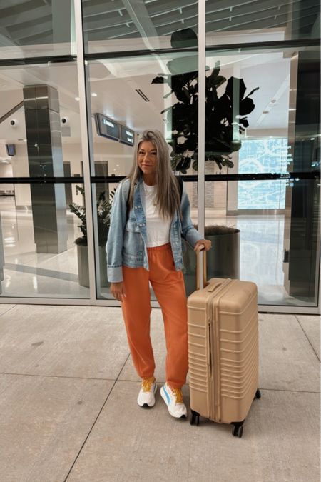 Travel ootd wearing my all time favorite sweatpants. I get a small they are comfy and perfectly oversized! Top is a small. Denim jacket is a closet staple and a perfect modern take on a denim jacket. My shoes are TTS! 

#LTKstyletip #LTKtravel #LTKshoecrush