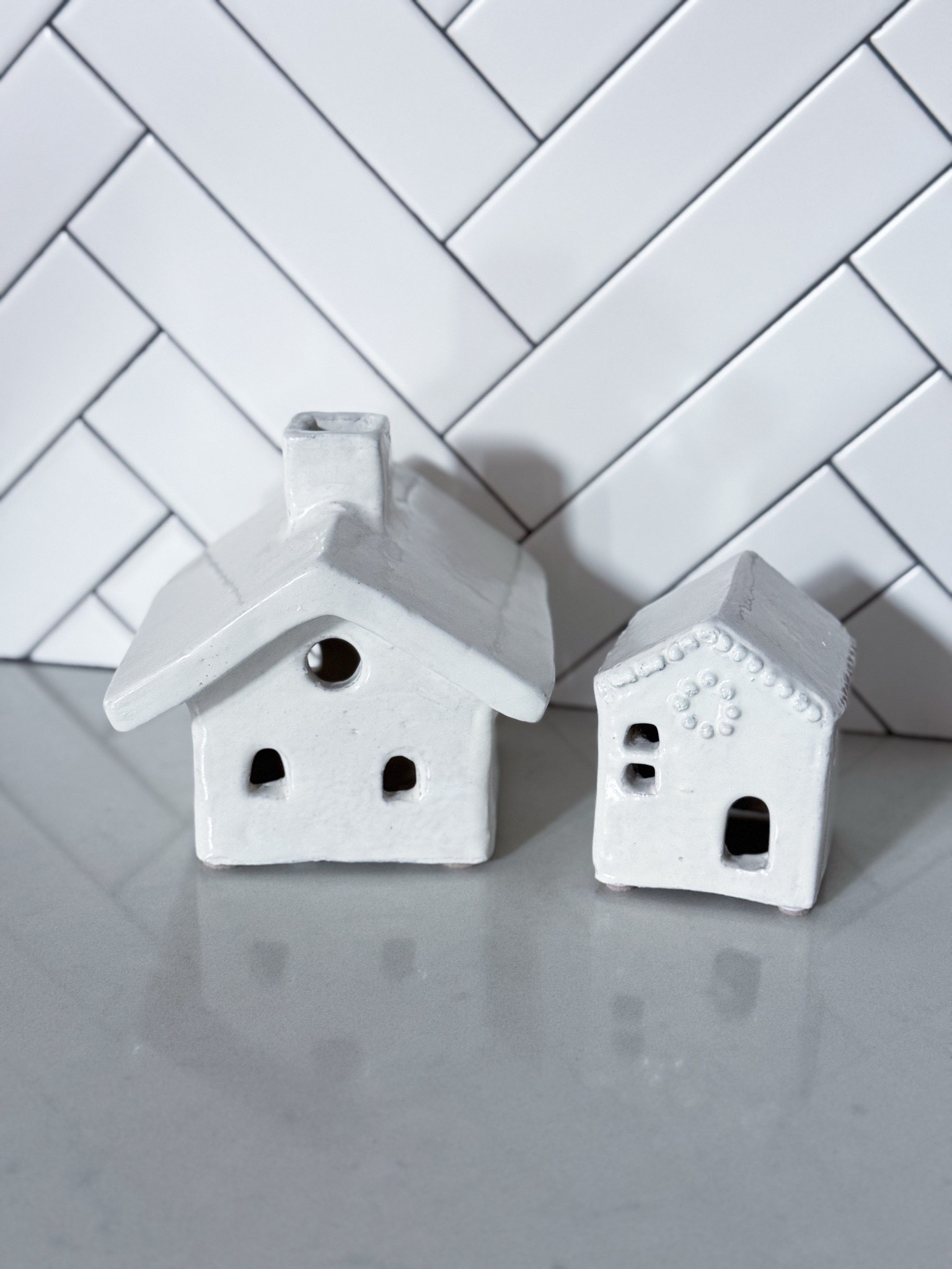 Our Handcrafted Ceramic Christmas Village Houses from Pottery Barn are back & they’re on sale right now. Each one is handmade, so no two are exactly alike. The soft, imperfect texture gives them that collected, heirloom feel I love this time of year. Perfect for a neutral Christmas setup on your shelves, mantel, or entryway table.

Pottery Barn Christmas decor - Ceramic village houses - Handcrafted holiday decor - Pottery Barn sale finds - Neutral Christmas home - Minimalist holiday styling - Pottery Barn holiday collection - Christmas village display - Cozy Christmas decorating - Handmade ceramic houses - Modern farmhouse holiday - Winter home accents - Holiday mantel decor - Classic Christmas village - Neutral winter decor - Elegant Christmas home - Pottery Barn home finds - Holiday decorating ideas - Warm neutral holiday style - Christmas shelf styling - Cozy winter home

#LTKHome #LTKSeasonal #LTKHoliday