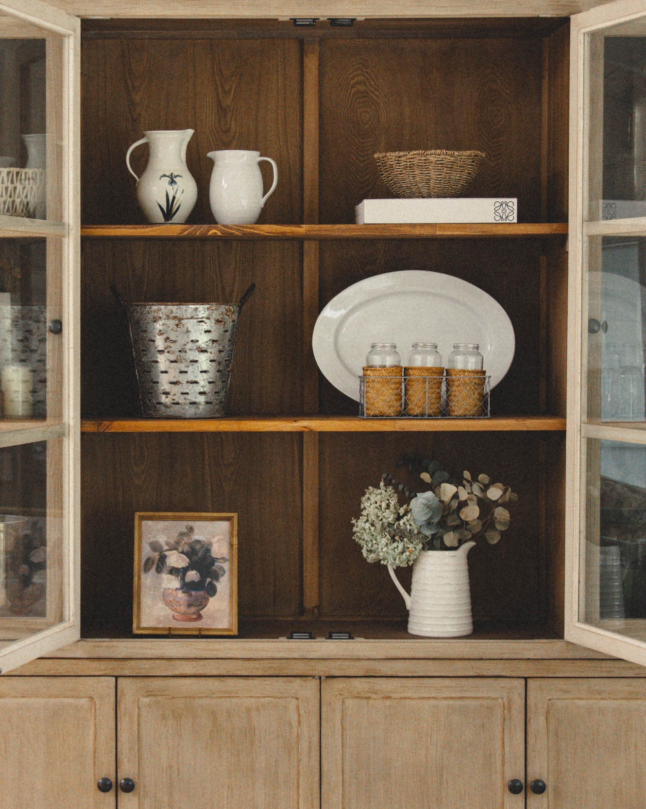 Neutral spring shelf refresh — layered ceramics, woven baskets, glass jars, and dried eucalyptus for a warm, modern rustic look.
I’ve linked the cabinet, pitchers, platter, baskets, vase, and similar framed art below.
These are timeless foundational pieces that work year-round.


#LTKdayinmylife #LTKmomlife #LTKHome