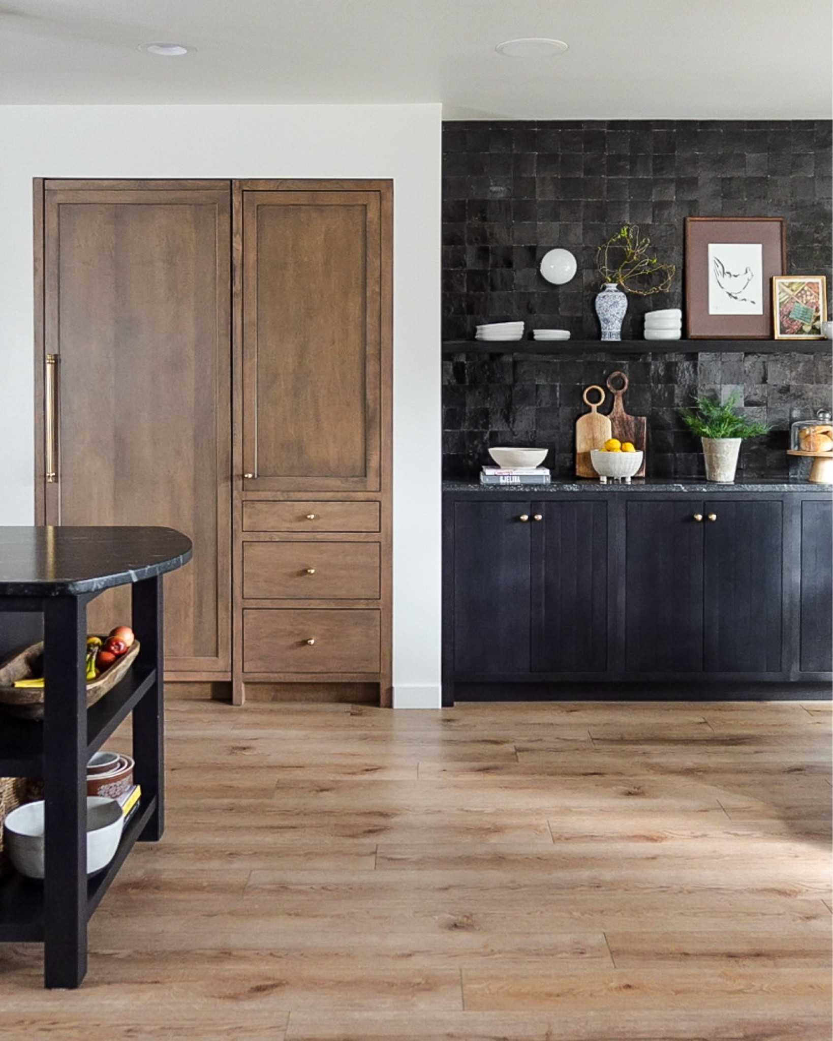 All appliance pulls, cabinet pulls and knobs and lighting is from  Rejuvenation - aged brass finish -  and linked here!

Maple Cabinetry is from Unique Kitchen & Baths, in both their “Smoke” and “Black” stain finishes.

The tile backsplash is Zellige 4x4 black squares from Riad Tile.

The stone backsplash is Alamo Sandstone Ledger from Floor & Decor.

Counters are Via Lactea leathered granite.

Paint color is “Pearly White” from Sherwin-Williams

Runner is vintage one of a kind from violet vintage rugs