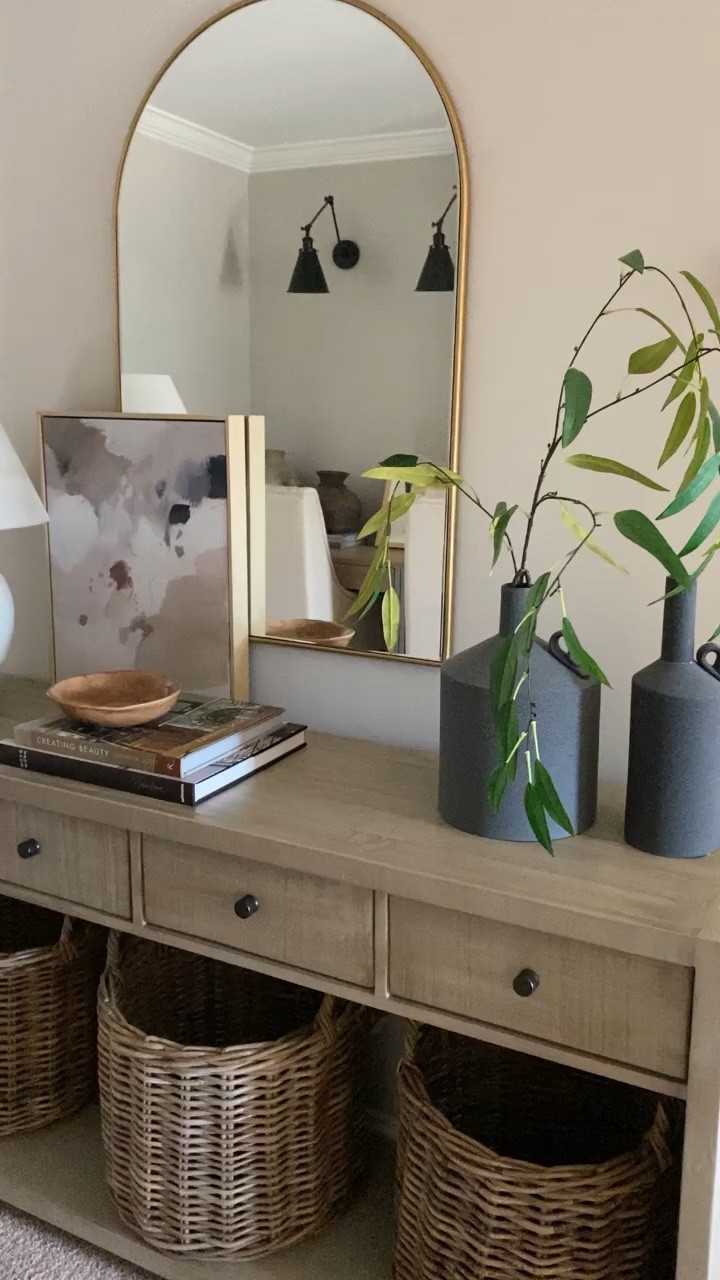 Entryway styling, hallway styling, console styling, design books, coffee table books, faux stems, arch mirror, white lamp

#LTKstyletip #LTKhome #LTKsalealert