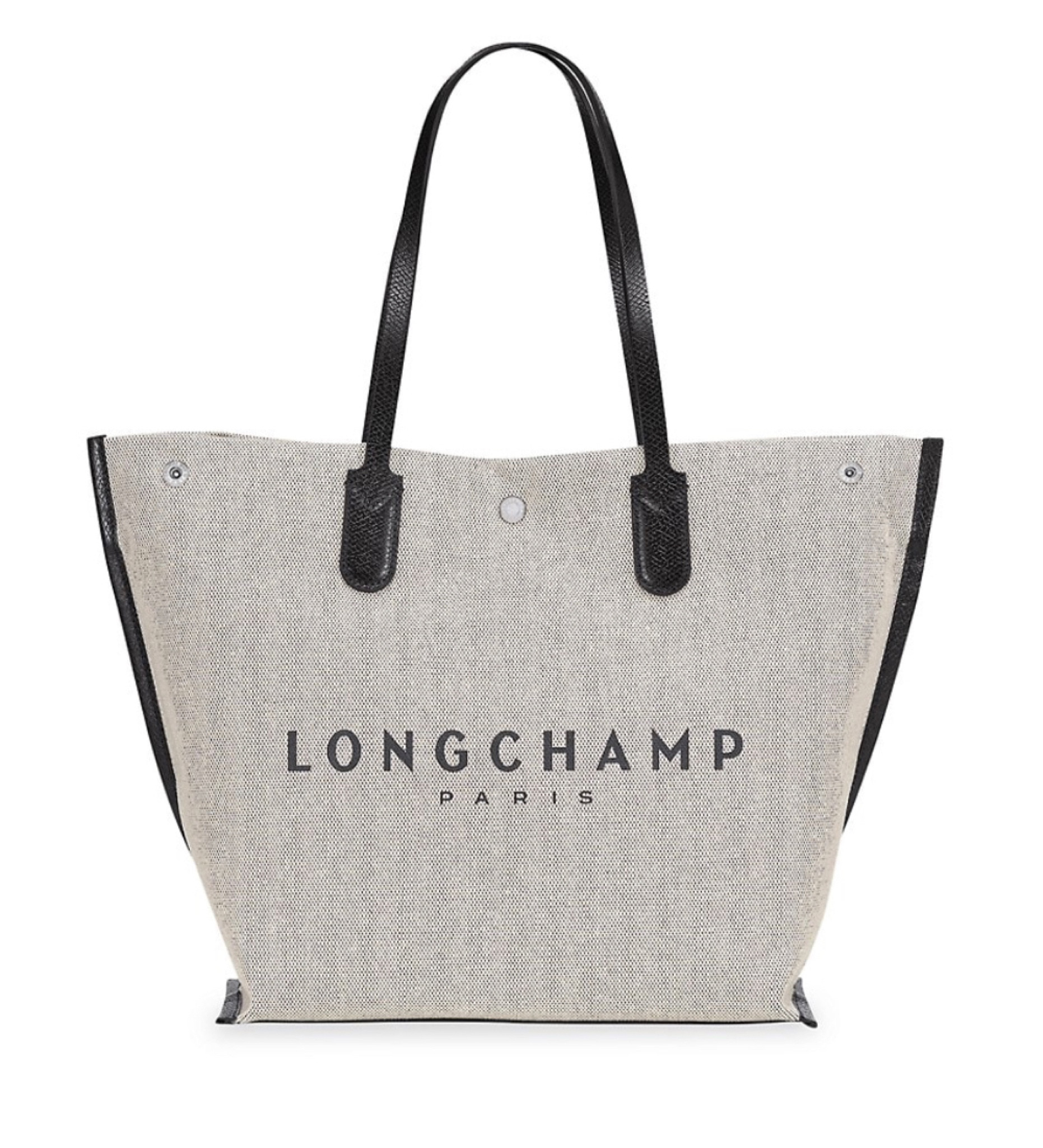 A rugged canvas construction edged with contrast trim defines this wear-everyday tote.
Dual top handle
Open top with snap closure
Foldout sides with snap closures
Cotton

#LTKtravel #LTKitbag