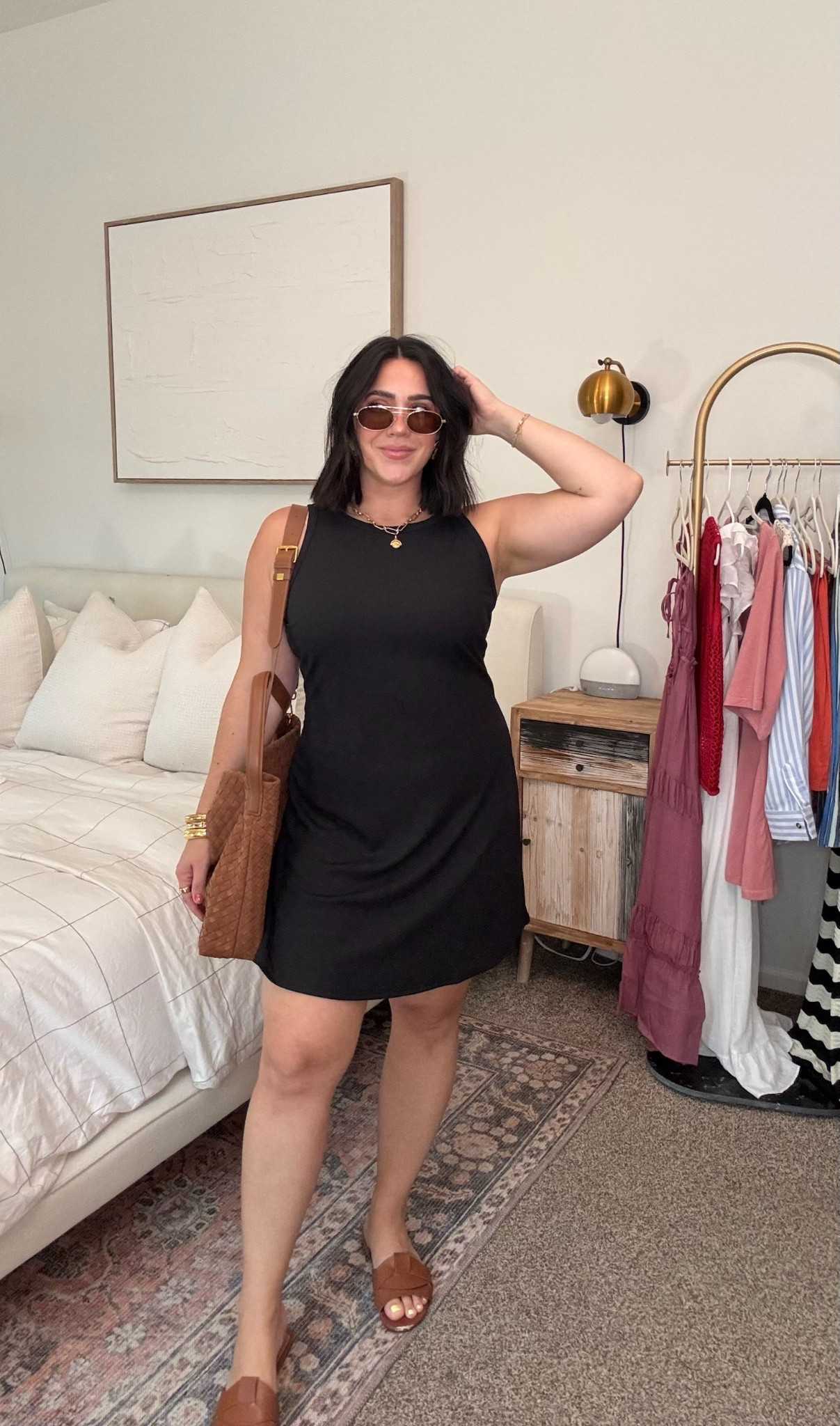 Little back sporty dress! Size L for me. It’s ribbed and stretchy. I’m 5’4 with longer legs. My shaping undies are a size L and i recommend sizing UP! You can use code ninaxspanx for 20% off as a new customer on the undies. Bag is suede. 

Casual spring dress, casual summer outfit, black dress, midsize 

#LTKFindsUnder50 #LTKMidsize #LTKStyleTip