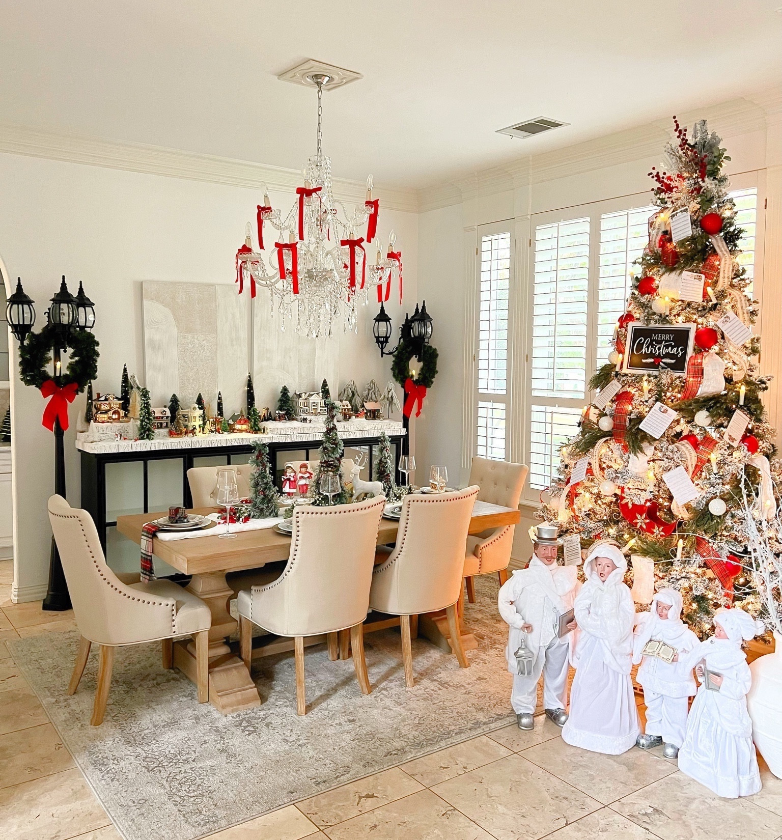 Christmas decor. Christmas carolers. Tree candles. Lamp posts. Dining table. Dining chairs 

#LTKhome #LTKHoliday