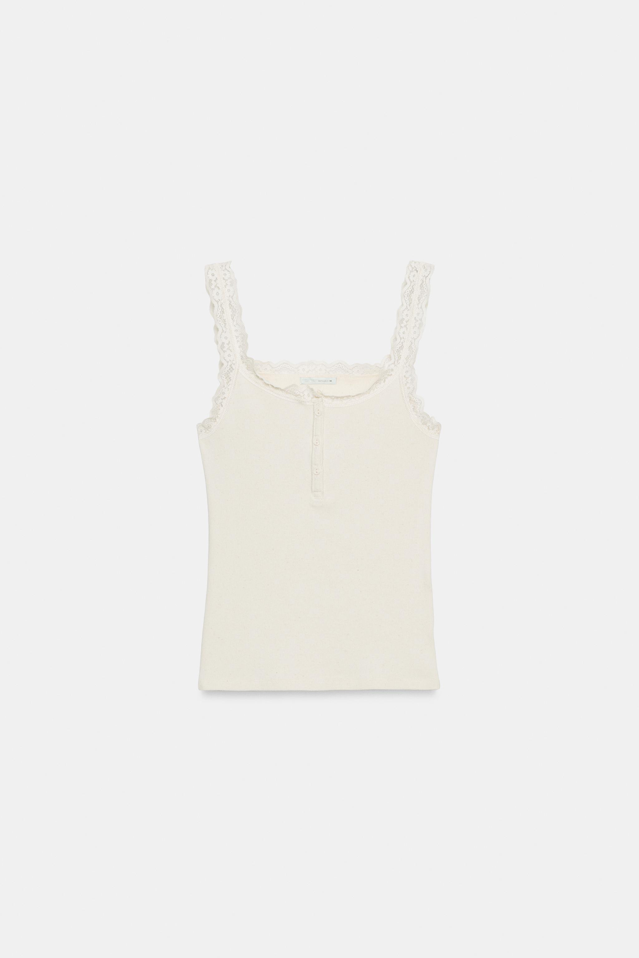 Top featuring a 48% linen blend main fabric. Round neckline with a buttoned placket. Wide straps. | Zara DE