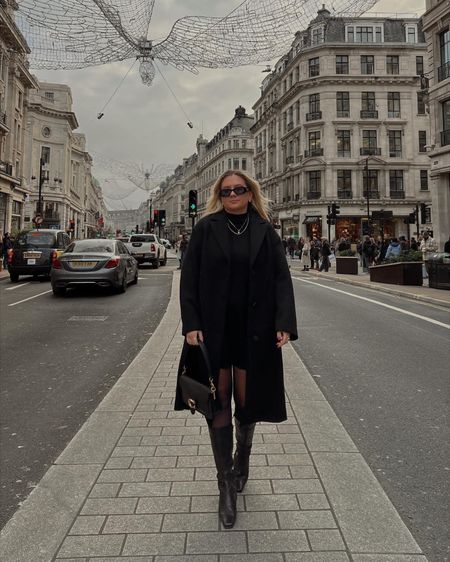 an all black outfit wearing a long oversized coat, a wool knit sweater dress, a coach tabby shoulder bag, prada square sunglasses and black knee high square toe boots 🖤 

#LTKstyletip #LTKeurope #LTKSeasonal