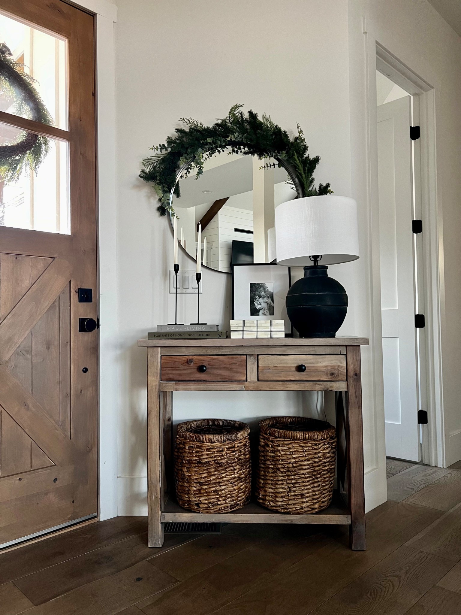 
A warm + welcoming entryway for winter 🤎🌿
Simple greenery, natural woods, a round mirror, and cozy baskets make this space feel styled but effortless. Tap to shop the console, mirror, lamp, baskets, books, and all the decor details that pull this look together.

#EntrywayDecor #LTKHome #LTKHoliday #NeutralHomeDecor #OrganicModernHome #ModernFarmhouseStyle #ConsoleTableDecor #HomeDecorInspo #StyledSpaces #LTKSaleAlert #CozyHomeStyle