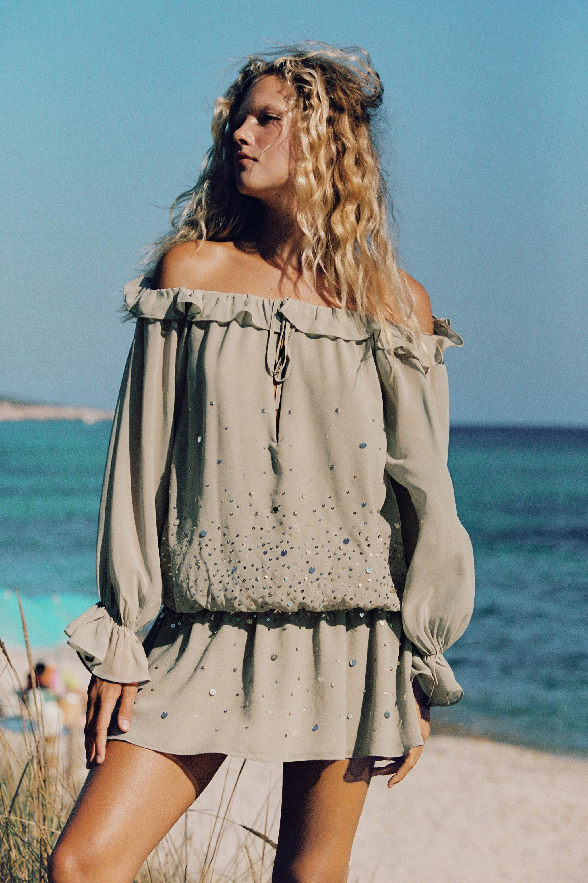Mini dress featuring a round neckline with elastic detail, an opening, and tie closure. Long slee... | Zara US