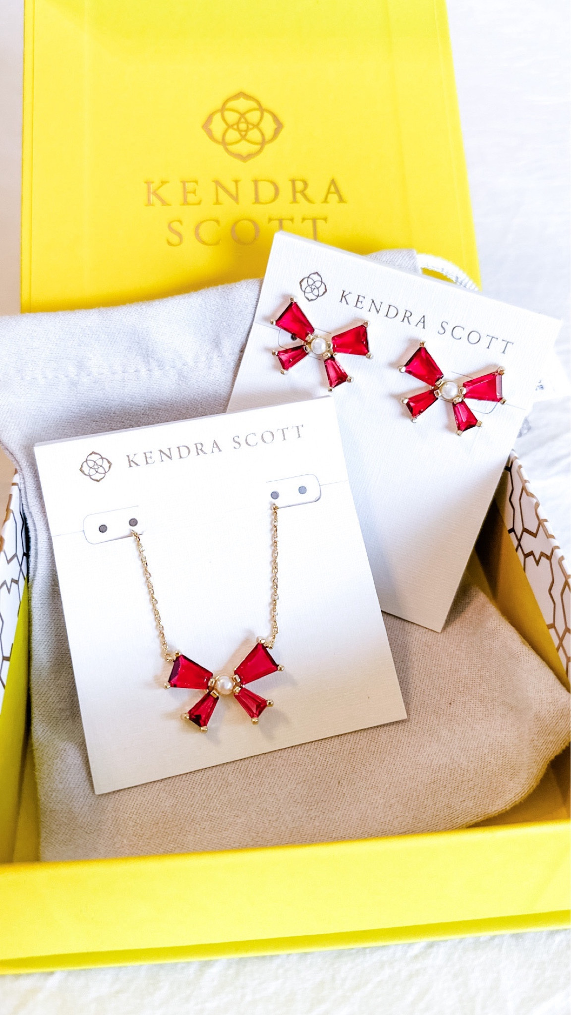 The prettiest set of bow earrings and necklace from Kendra Scott for the holiday season! I love the red jewels. These pieces are available in other color combinations too. I had to order my earrings from Kendra Scott and my necklace from Dillards because the necklace sold out in the red. ❤️ Linking them for you! 

I always buy a new bow jewelry piece each winter and this set is so gorgeous!! I’m so happy I ordered. 

#LTKGiftGuide #LTKHoliday #LTKfindsunder100