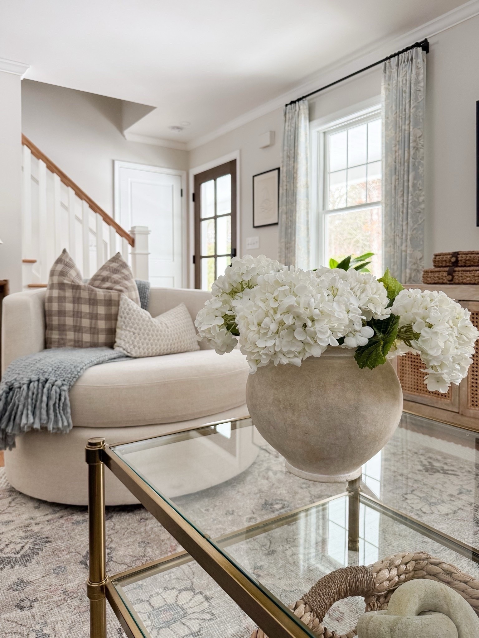 Coastal living room corner styled with woven basket planter, textured ivory rug, and layered neutral furniture for relaxed coastal home styling.

coastal living room styling, woven basket planter, ivory textured rug, neutral living room decor, coastal interior design, houseplant basket planter, layered neutral home decor, light coastal interiors, sherricalnanhome 

#LTKHome