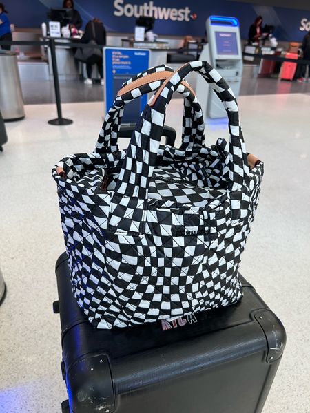 Love my new travel tote! Everything fits in here, even my laptop! It’s squishy soft and comes with a removable pouch that I stored a change of clothes in just in case. 

#LTKtravel #LTKfamily #LTKitbag