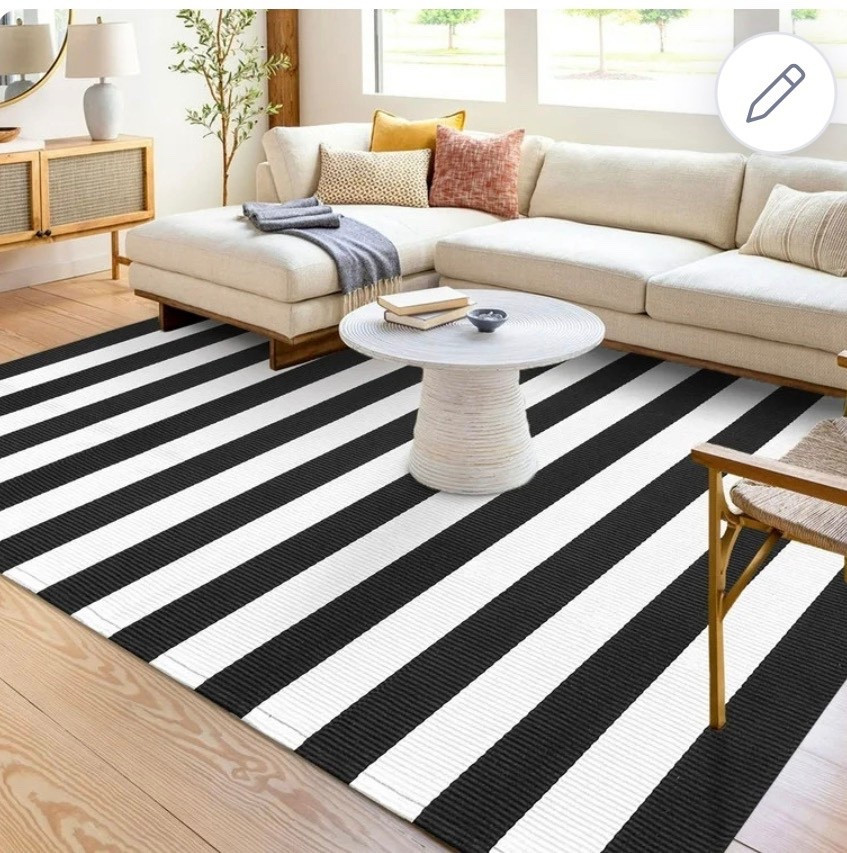 White a black striped outdoor rug. 
#rug
#deckrug

#LTKHome
