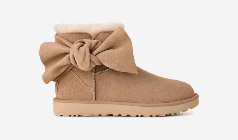 UGG® Women's Classic Mini Bow Suede Classic Boots in Sand, Size 8 | UGG (US)