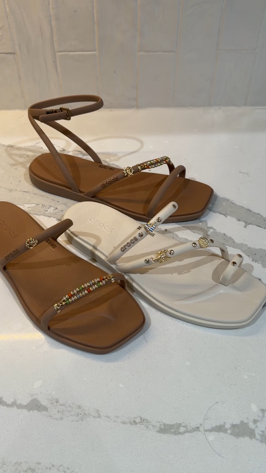 I am absolutely obsessed with these new croc sandals, and charms to go on them!!! the sandals are so cute and comfy. They are very squishy. The white toe strap style do run more true to size than the other pairs do. The two straps sandals and the ankle sandals run extremely roomy. I’m an 8 to an 8 1/2 and could not size down to a 7 though because they were too tight on my toes.

#LTKmomlife #LTKOver40