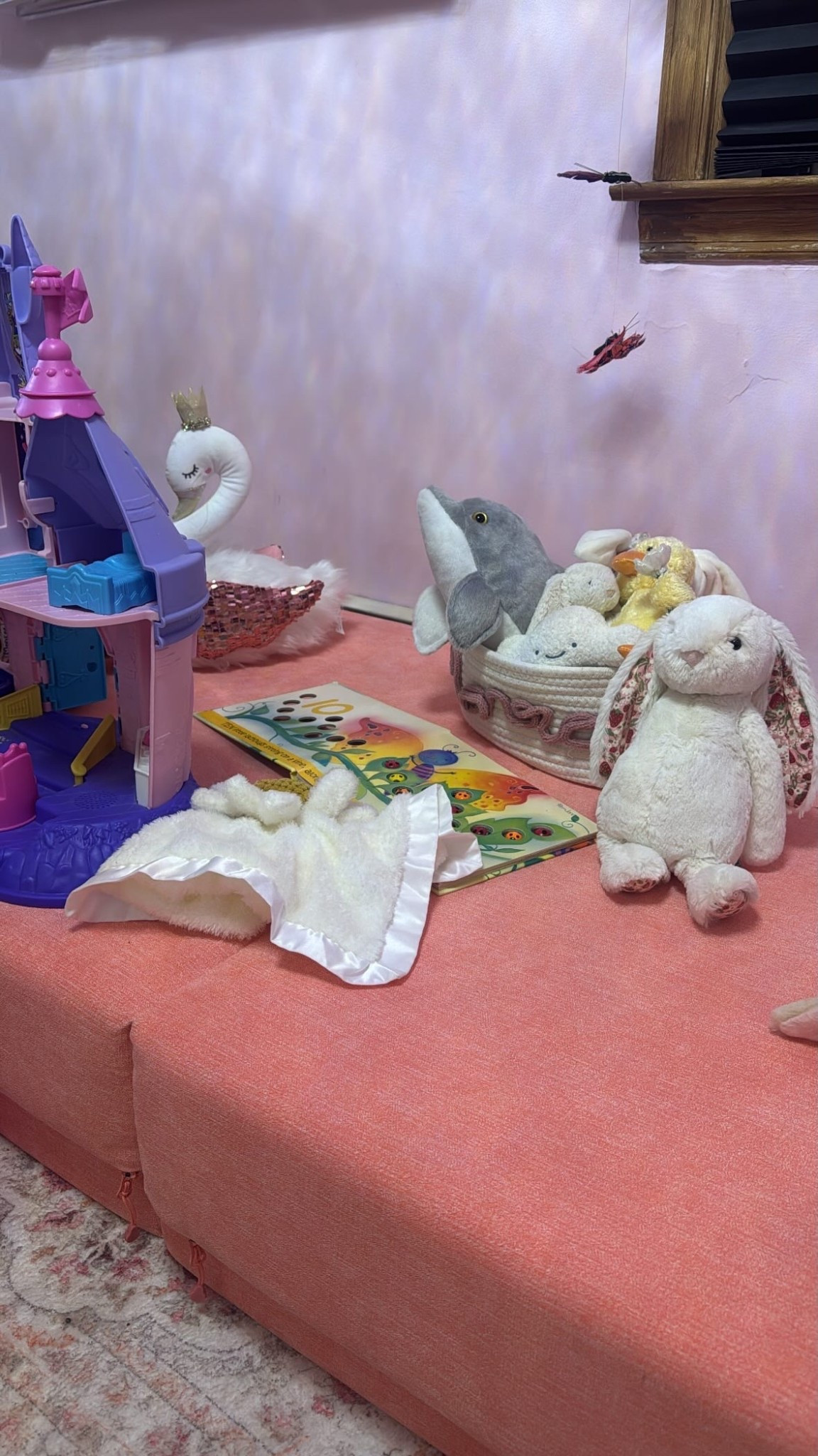 This space has quickly become one of my daughter’s favorite places to explore, create, and wind down with her favorite toys. The Nugget couch is such a fun and versatile piece — perfect for building cozy forts or turning into a comfy little sitting area for reading and pretend play.

Her swan plush adds the sweetest touch for make-believe adventures, while her beloved daisy lovie (which seems to go everywhere with us) always finds its way back to this spot. The Little People princess castle has been a big hit for storytelling and creative play, and we always keep our favorite book, Ten Little Ladybugs, close by for quiet moments together.

A small space filled with imagination, cozy play, and some very loved little treasures. Links to everything are below if you’re interested. 🦢💗

#LTKmomlife #LTKHome #LTKdayinmylife