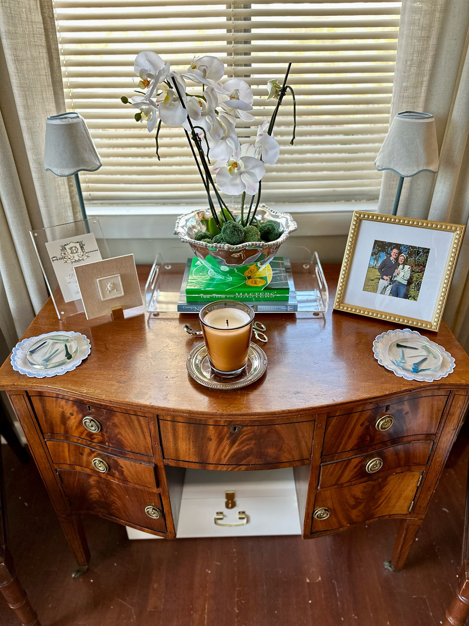 This small vanity piece was one of my first Facebook marketplace purchases and I still love it just as much today as when I bought it! We have tablecloths, napkins, coasters, and napkin rings tucked in its drawers and a fake orchid in a pretty Beatriz Ball bowl that was a wedding gift displayed on top 

Our living room so far feels pretty finished, but there are still some updates I’d like to make! Here’s a look at how it looks now to give you an idea of the space we’re working with and the different vignettes set up in the room!

First house, living room, blue and green decor, southern traditional, antique furniture, smaximalist, southern maximalism, affordable home decor, interior design hack, cane furniture, faux bamboo furniture, ikea sofa, skirted table

#LTKhome #LTKfindsunder100 #LTKfindsunder50