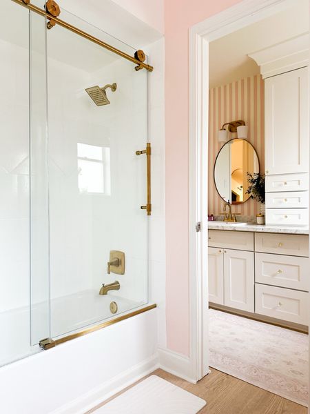 Such a cute, whimsical bathroom for little girls. The gold accents really make the whole space feel so elegant.

#LTKhome