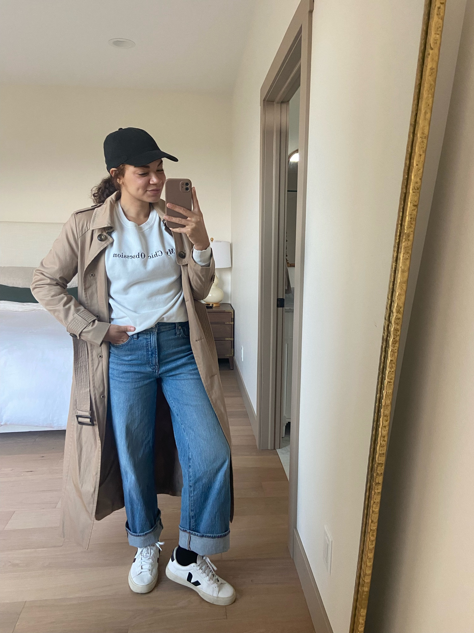 Casual fall outfit idea - Wear this for getting coffee or school drop off. With a baseball cap, sweatshirt, cuffed wide leg jeans, socks, and a trench coat, this outfit is perfect parts casual and comfy! This fall outfit is easy to wear for your personal style. You can always pair it with clogs for some easy slip on shoes 

#LTKxMadewell #LTKSeasonal #LTKstyletip