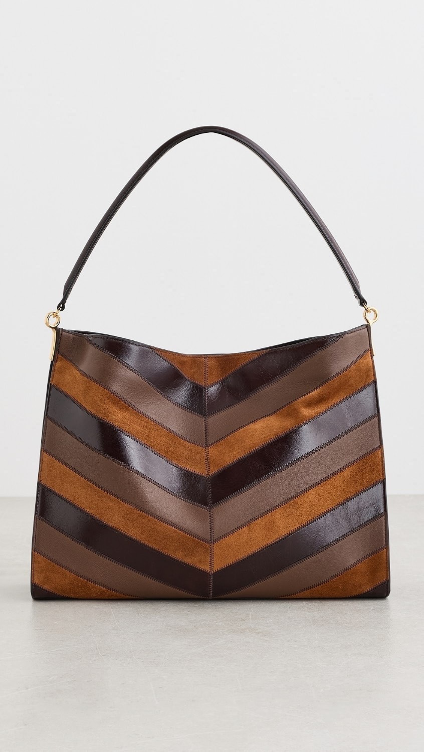 Veronica Beard
Chevron Vida Bag

This Veronica Beard tote is crafted from leather and features gold-tone hardware, a chevron pattern, and an optional adjustable strap

#LTKootd #LTKTravel #LTKWorkwear