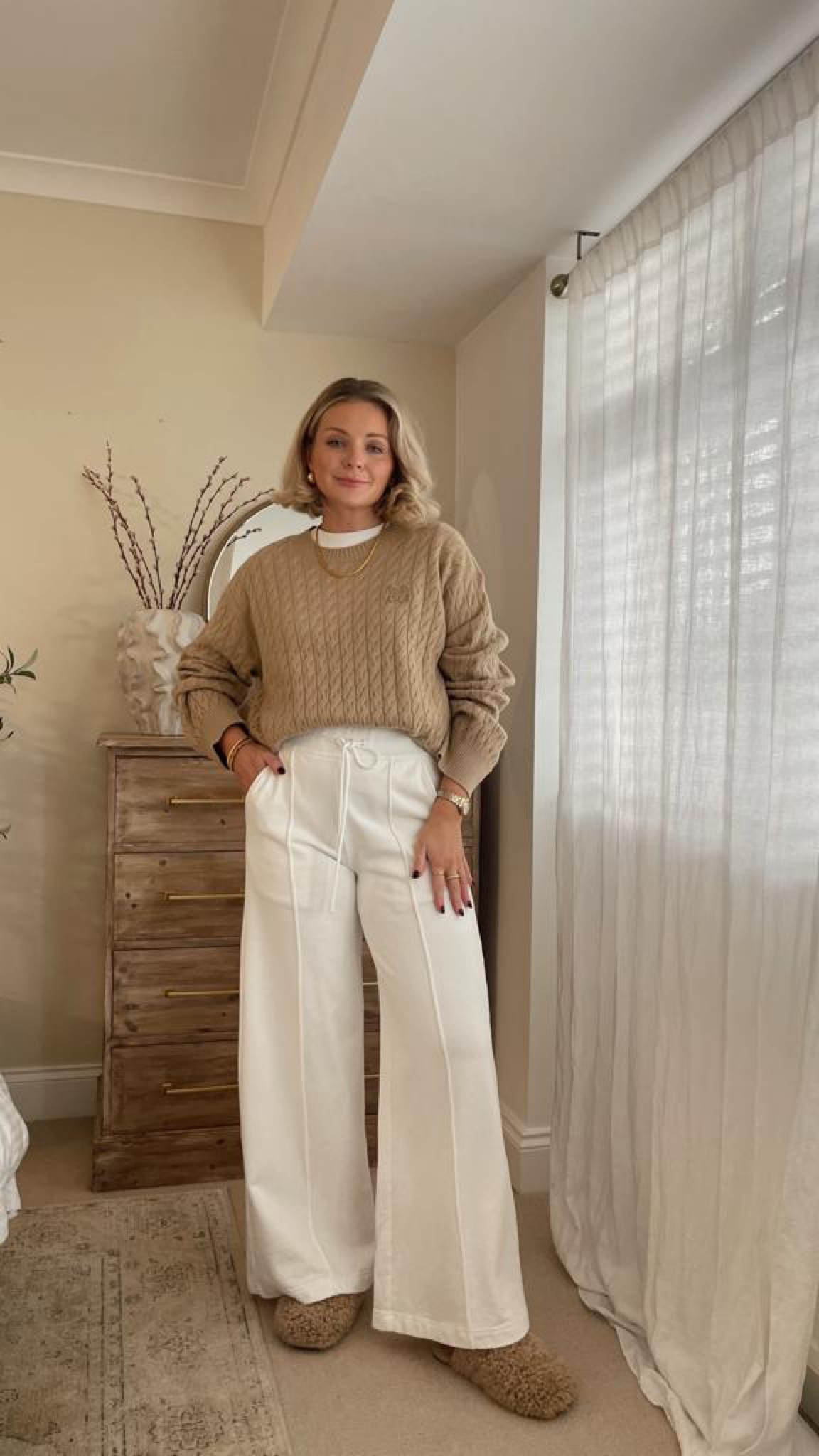 Cosy at home outfit - beige cable knit jumper and white drawstring trousers from MO&Co, Ugg maxi curly slippers (similar colour linked) and white cos clean cut t shirt  

#LTKstyletip #LTKSeasonal #LTKeurope