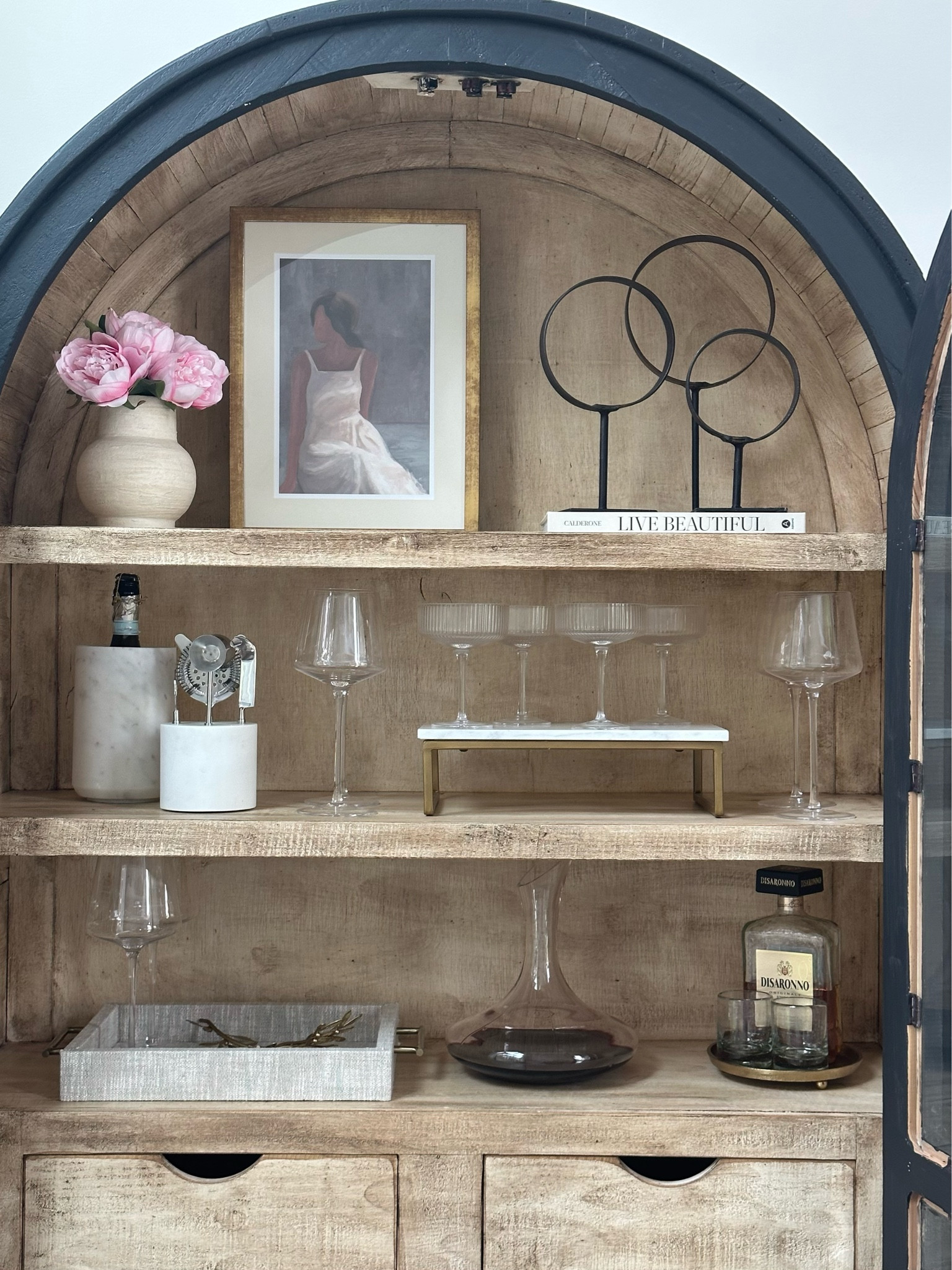 Bar Cabinet Essentials
Wine glasses. Champagne flutes. Decanter. Bar accessories. Art. Book. Tray.

#LTKhome