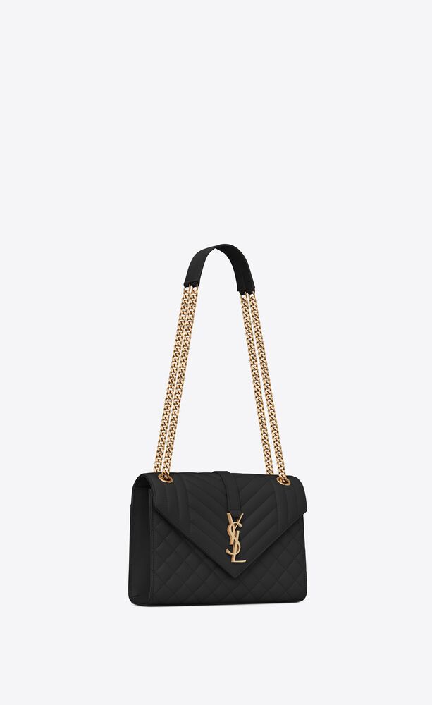 Saint Laurent Monogram Envelope bag made with metal-free tanned leather with a front flap and mag... | Saint Laurent Inc. (Global)