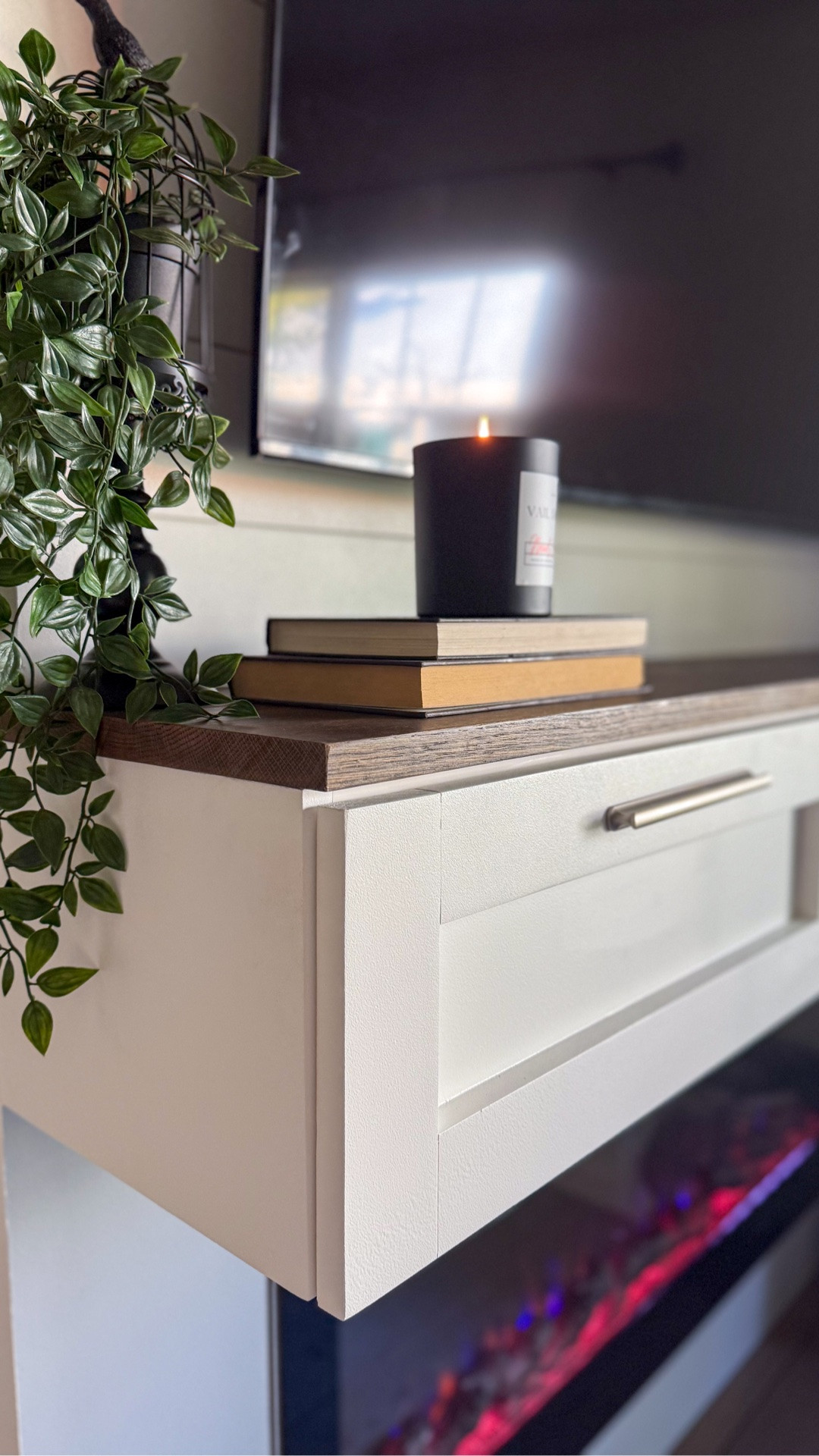 From builder-basic to perfectly custom. This once-blank TV wall became a beautiful focal point that completely transformed the feel of the room. Thoughtful storage keeps cords and clutter out of sight, while the electric fireplace creates a warm welcome the moment you walk through the door.

#LTKHome