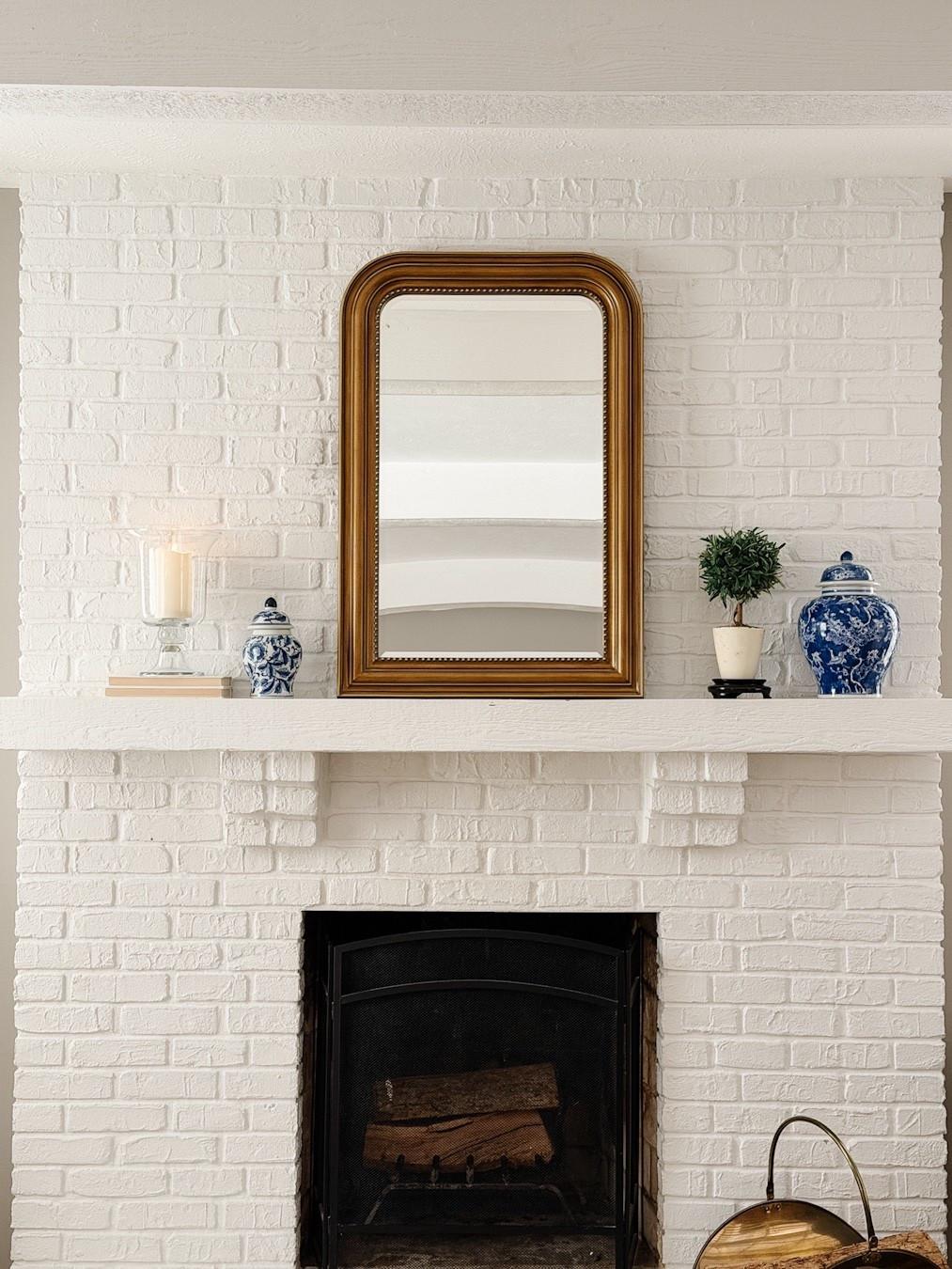 Living room refresh!  A mix of vintage and new finds for our living room fireplace mantle. 

Transitional design inspo, traditional design inspo, flameless candle, footed glass hurricane, gold mirror, blue and white ginger jar, faux topiary, chinoiserie , living room inspo, living room design, living room refresh 

#LTKSaleAlert #LTKHome