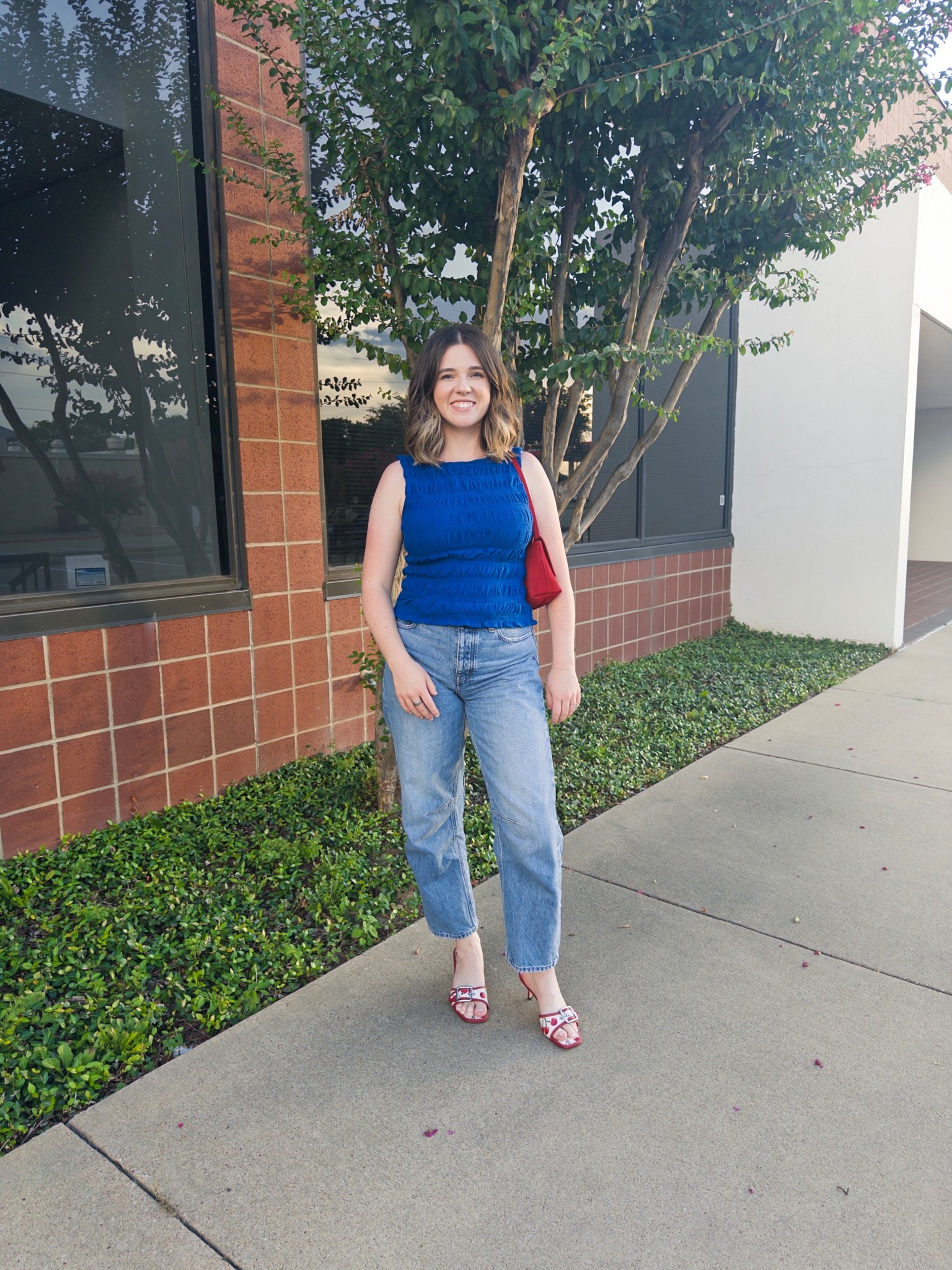 Daily work outfit 
Madewell blue tank 
Madewell barrel jeans 
Coach cherry shoes 
Madewell red purse 

#LTKItBag #LTKShoeCrush