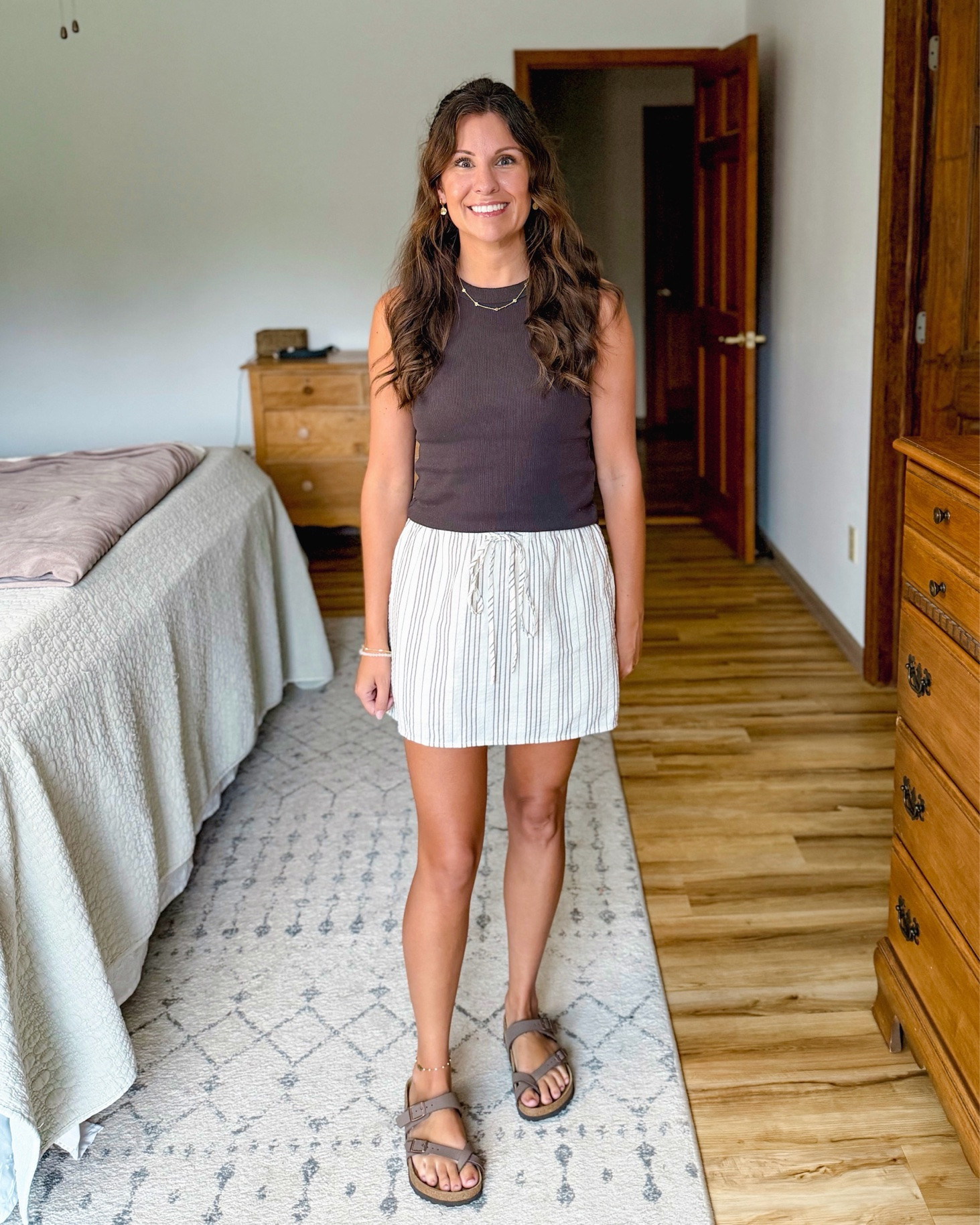 Easy mom outfit🤎 This skirt with built in shorts is soooo cute! Comes in a couple other colors too.

Small in my bra, small in my tank and xs in my skirt/skort. My sandals are size 36.

Im 5’1” and around 100lbs for reference

#LTKPetite #LTKootd