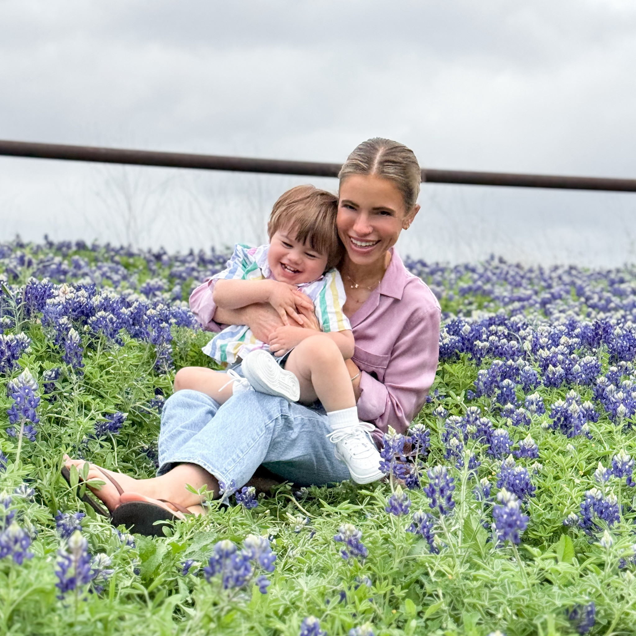 Bluebonnet season in Texas 🪻 Im wearing a lavender silk shirt from equipment, jeans from levis, and brown leather flip flops. P is wearing a colorful stripe cotton linen shirt from gap, chambray shorts from gap factory, and kids white airforce ones from kids foot locker. 

#LTKfamily #LTKSeasonal #LTKkids