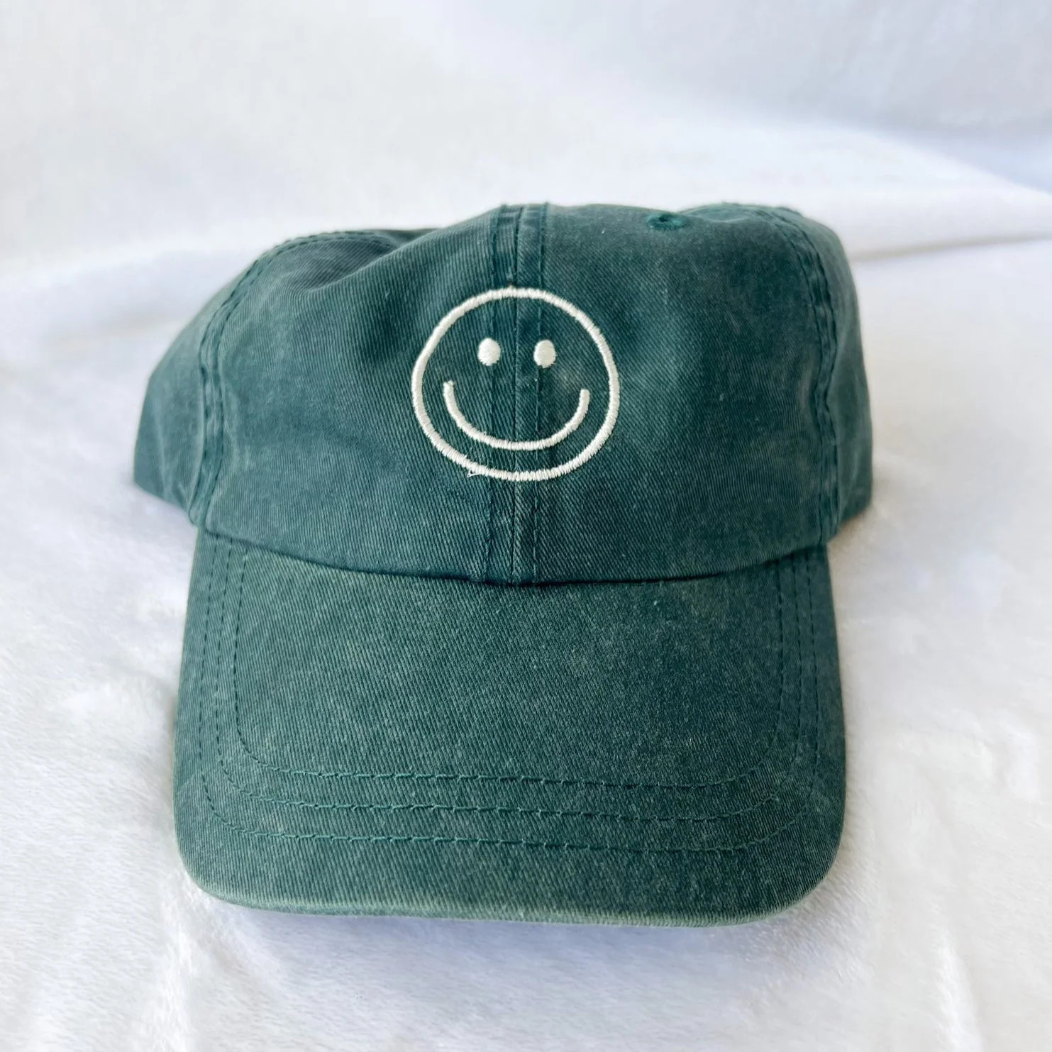 smiley face hat | teal | Reef rain aria