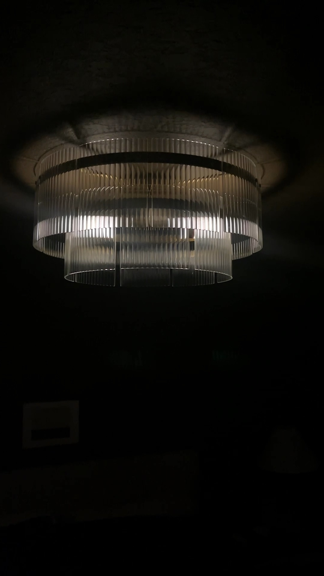 Brass, glass, and crystal semi flush chandelier with ribbed and included glass panels. This chic ceiling light fixture looks absolutely perfect against dark brown and moody walls. The size is perfect above a king size bed. 