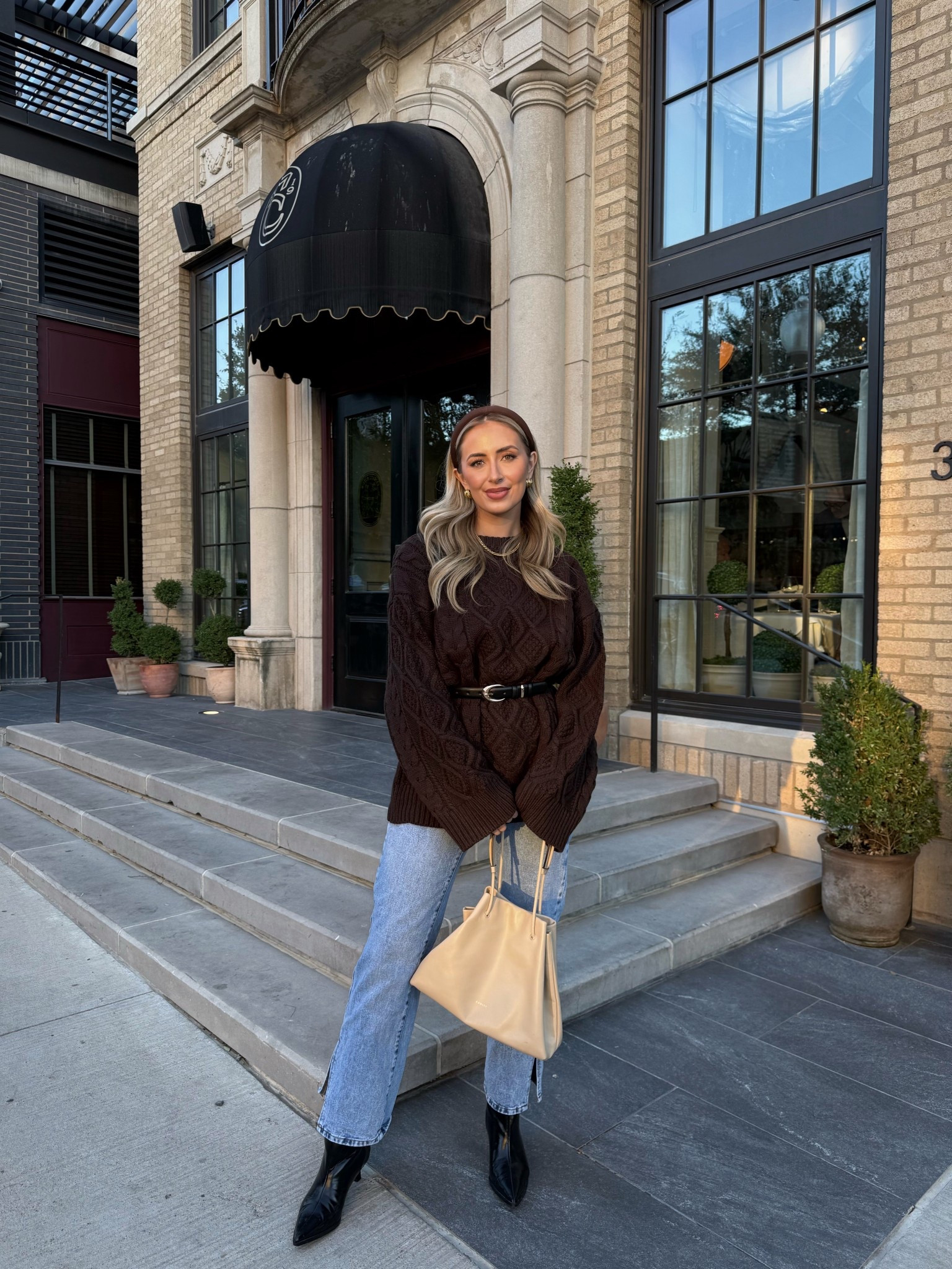 Chunky knit sweater styled with split hem jeans and black boots for fall dinner date 🫶🏼 

#LTKFindsUnder100 #LTKStyleTip