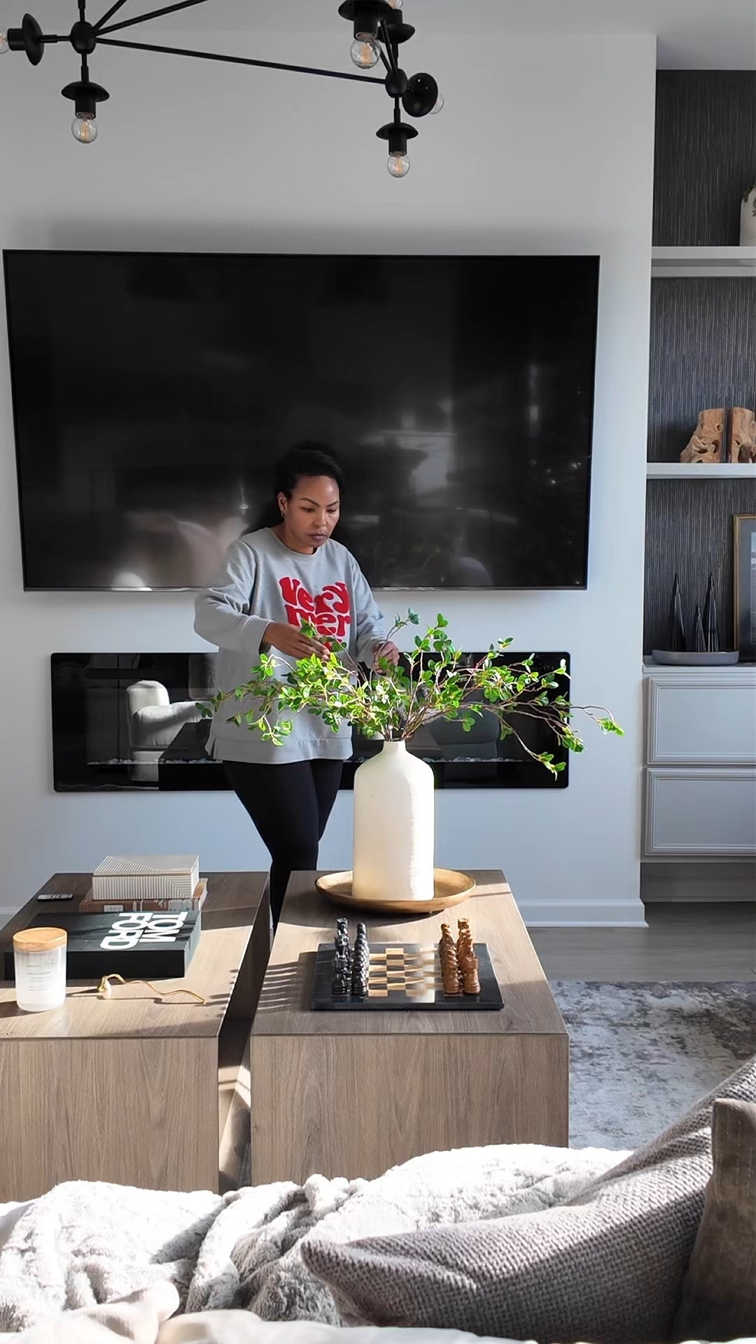 I don’t always add — sometimes I adjust.
Fixing the greenery stems on the coffee table so everything feels balanced.

#LTKHome #LTKSeasonal