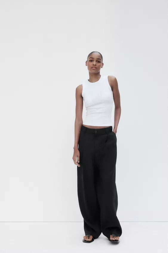 High-waisted pants with belt loops. Pleated detail. Side pockets and faux welt back pockets. Fron... | Zara US