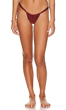 Kulani Kinis Ruched Bikini Bottom in Sweet Cinnamon Shimmer from Revolve.com | Revolve Clothing (Global)