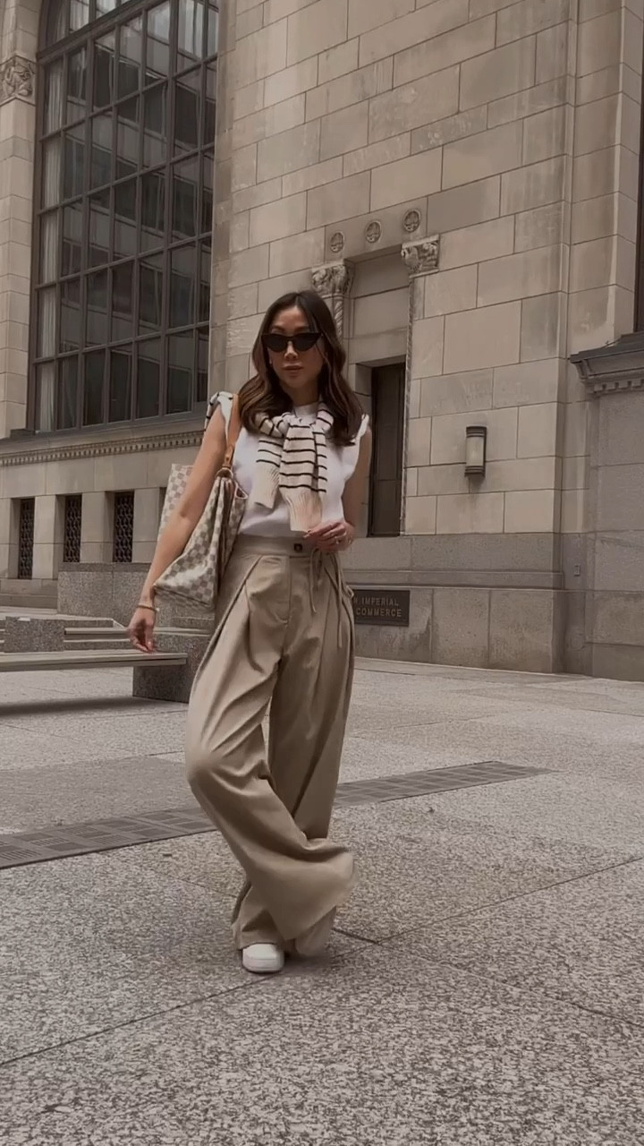 Casual work day with wide leg pants and knit top with striped sweater and sneakers 

#LTKworkwear #LTKSeasonal #LTKFind