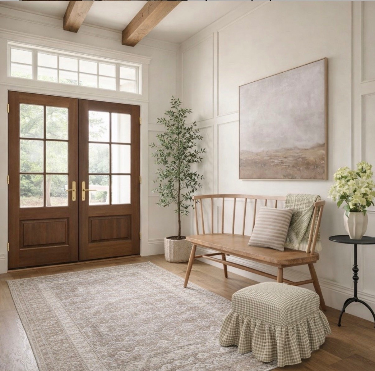 A light-filled spring entryway layered with soft neutrals and natural textures. Wood double doors with divided-light glass and a transom window, exposed beams, and a vintage-style neutral rug create warmth and character. A wood spindle bench styled with a throw and striped pillow, faux olive tree greenery, a pedestal side table with florals, and a gingham accent stool complete this calm inspired look.

#LTKSeasonal #LTKHome