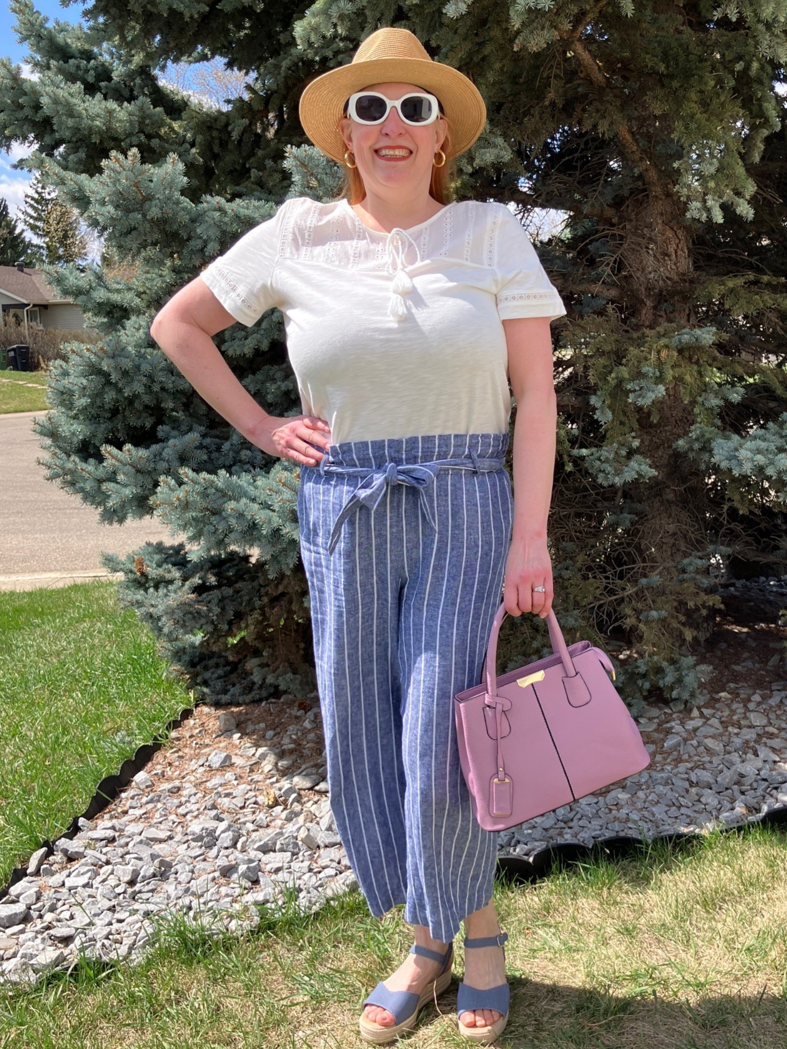 I’m dancing with myself in this springy look! Some fun sunnies, a hat, a white t, striped pants with blue sandals to match, and a lavender bag and I’m ready for the weekend. Whether heading for groceries or a soccer game I’m ready for it! Hopefully the weather warms up soon. Canadians click on the first links to shop, and Americans click on the second links to shop. If there’s only one link then you can shop it in your own country. And remember, trendy doesn’t have to be expensive! Bye!

#LTKsummer #LTKover50style #LTKcanada