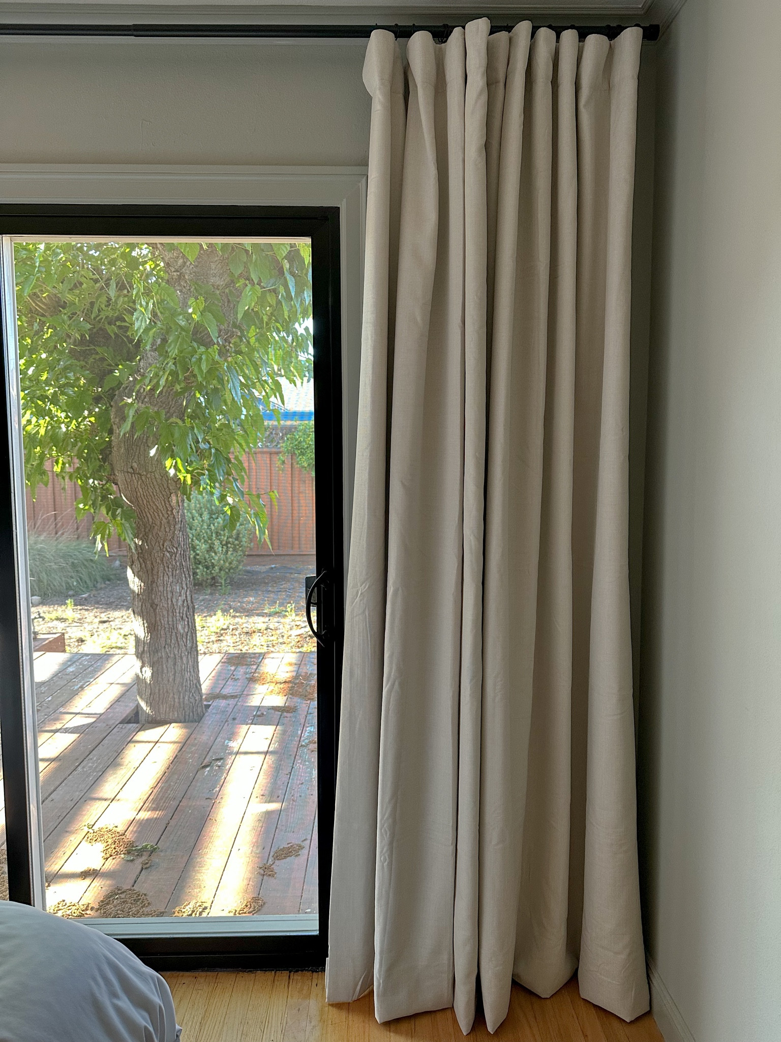 Blackout curtains; linen curtains on a budget; no sew no iron hemming tape; black curtain rod; curtain rings