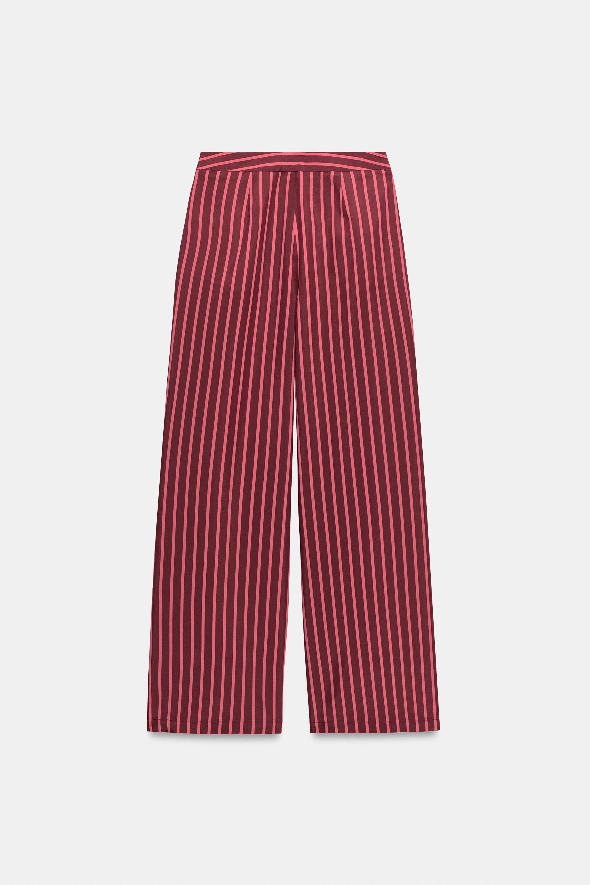 High-rise trousers with front pockets. Wide-leg design. Front zip, inside button, and hook fasten... | Zara US