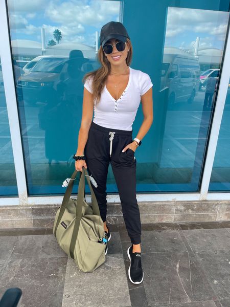 Henley bodysuit Xs black joggers Xs apl sneakers duffel bag washable travel vacation outfit 

#LTKsalealert #LTKunder100 #LTKunder50