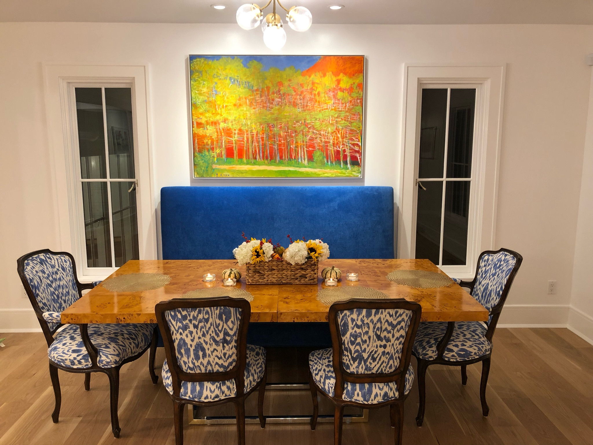When we renovated our home, we decided to paint every wall white…but our house never looks white because it is a backdrop for our colorful decor choices. I had this banquette custom made in cobalt blue along with antique chairs reupholstered in a blue and white print. Create tension and interest with items from different eras- like our antique chairs with the burled wool table. Happy decorating!

#LTKfamily #LTKhome #LTKstyletip