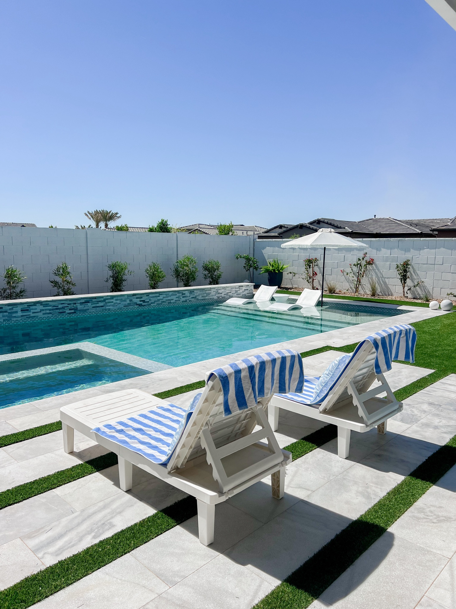 Our pool is done! Now can these plants hurry up and catch up?! Linking our pool favorites here! #LTKhome

#LTKSeasonal