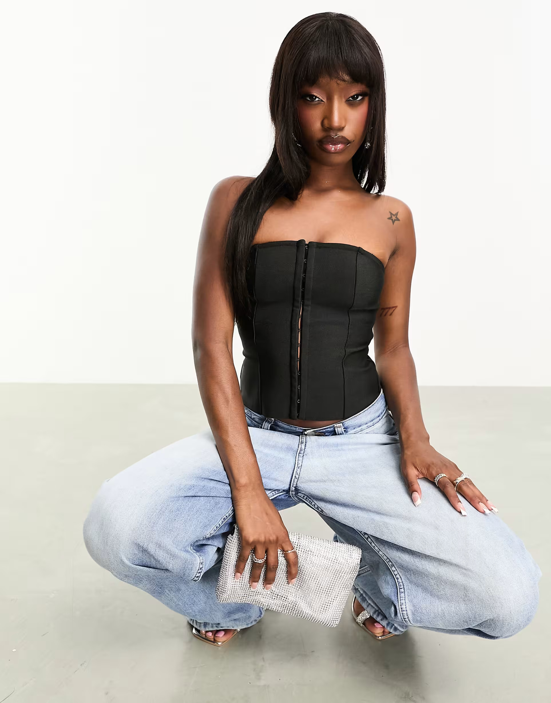 ASOS DESIGN bandage corset top with hook and eye fastening in black | ASOS (Global)