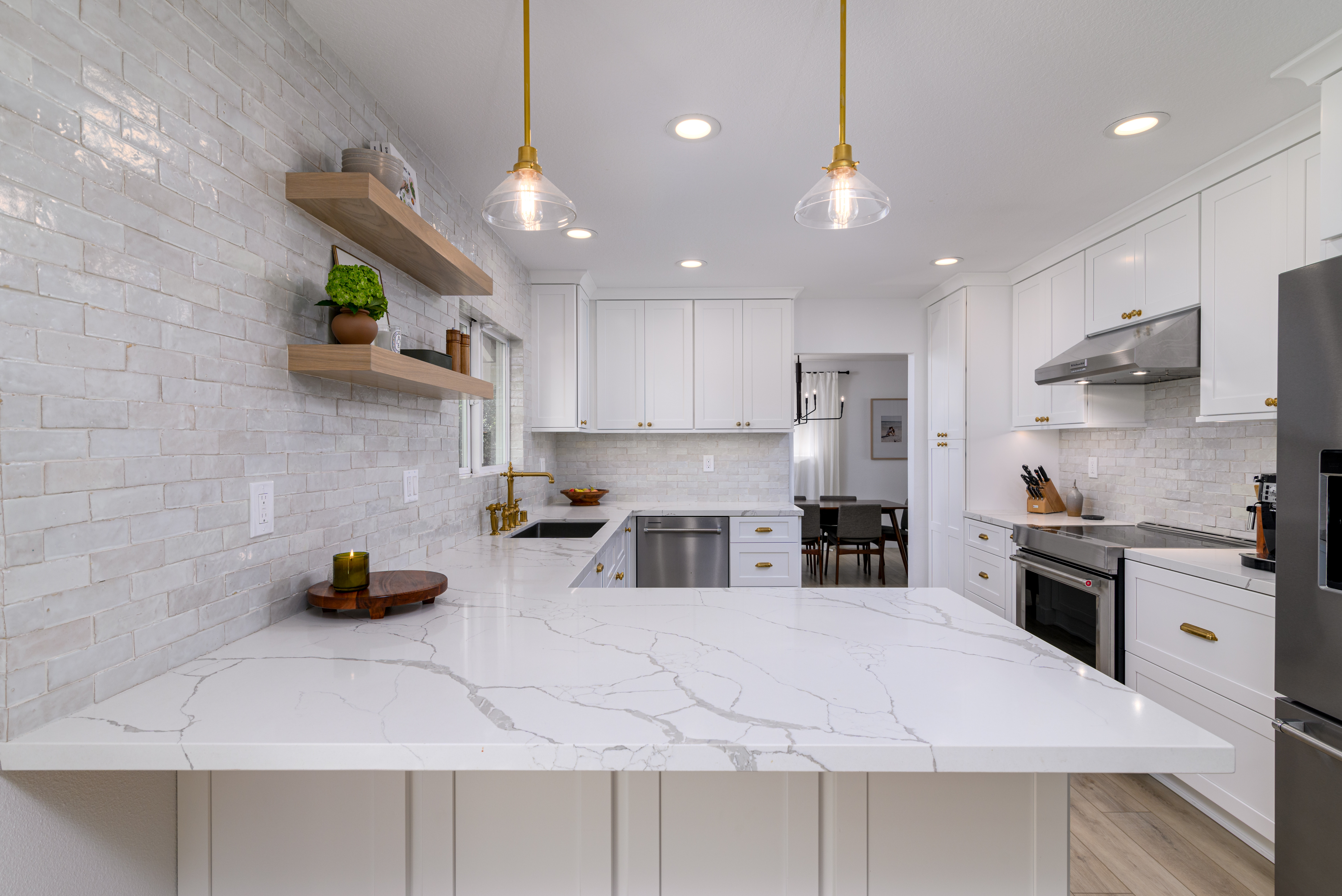 A fresh take on classic design—white shaker cabinets, warm brass accents, and a stunning zellige backsplash bring timeless charm to this kitchen. 

#KitchenDesign #KitchenRemodel #DreamKitchen #InteriorDesign #HomeInspo #ShakerCabinetry #BrassHardware #VintageKitchen #TimelessDesign #ZelligeTile #MarbleLookQuartz #WhiteOakFloors #LuxuryKitchen #KitchenTrends #BridgeFaucet #ClassicKitchen #HomeRenovation #CustomCabinetry #KitchenGoals #DesignBuild 

 #LTKHome