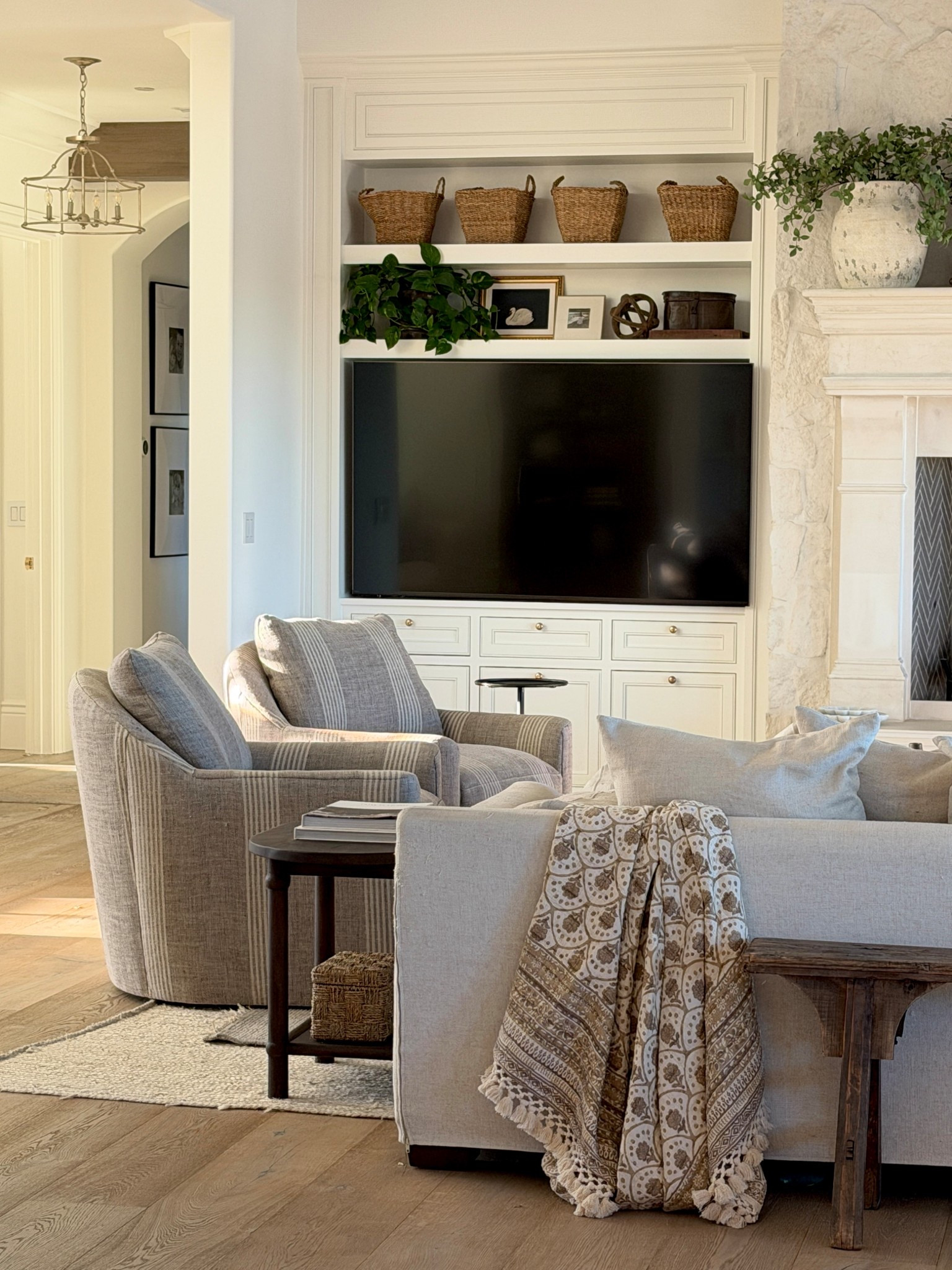 Our swivel chairs are on sale!  It took me forever to find swivel chairs that were large enough for men to be comfortable.  Most are tiny!  And I wanted a pattern that would hide any dirt since they aren’t slipcovered.  We chose linen in Morelle Stripe.!  They are still a splurge, but I get asked about them all the time!  

Also linking other family room furniture!

#LTKSaleAlert #LTKHome